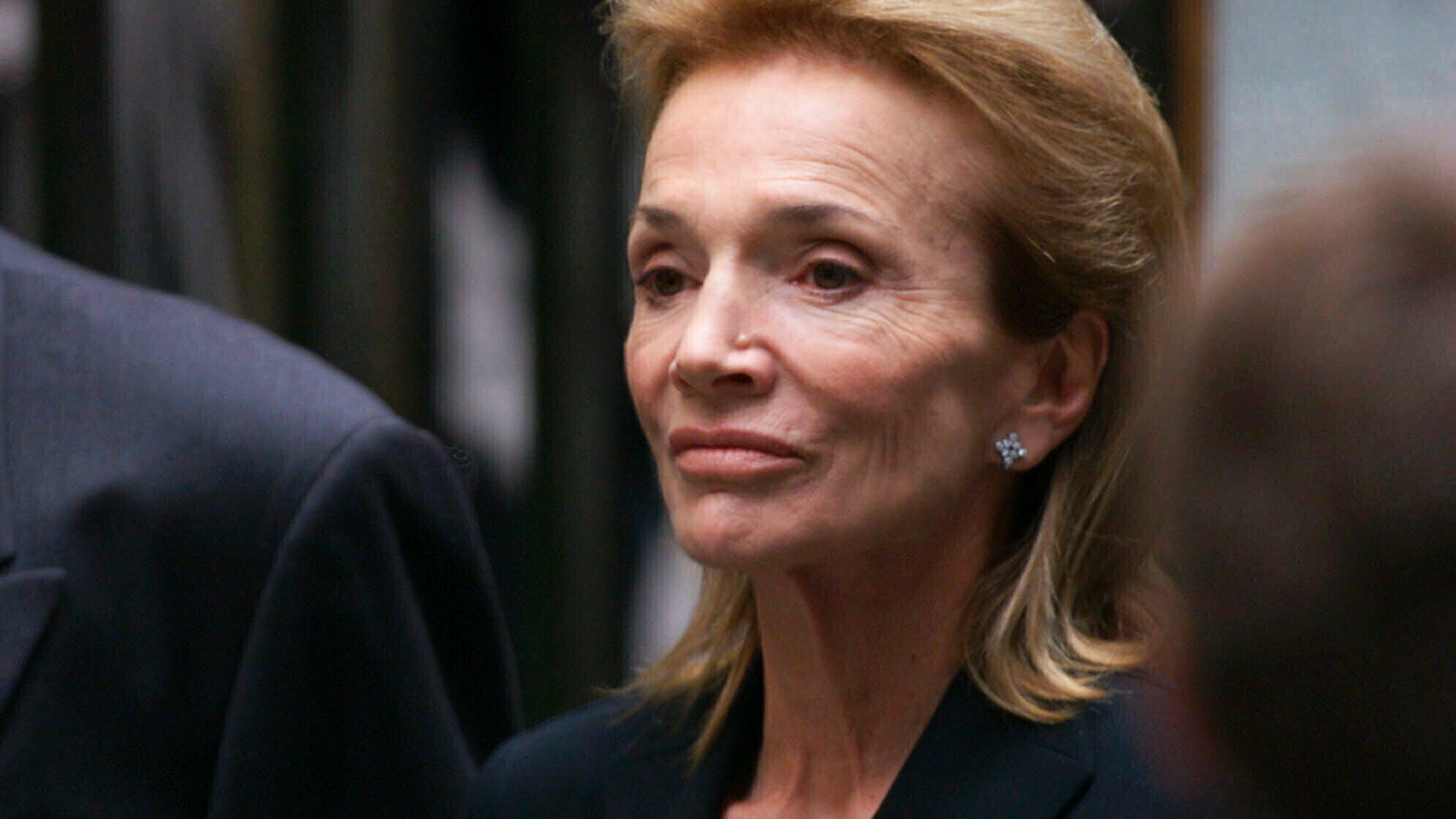 FILE - In this July 23, 1999 file photo, Lee Radziwill, sister of Jacqueline Kennedy Onassis, leaves the Church of St. Thomas More in New York. Radziwill, the stylish jet setter and socialite who made friends worldwide even as she bonded and competed with her older sister Jacqueline Kennedy, has died. She was 85. Anna Christina Radziwill told The New York Times her mother died Friday, Feb. 15, 2019, of what she described as natural causes. (AP Photo/Doug Mills, File)