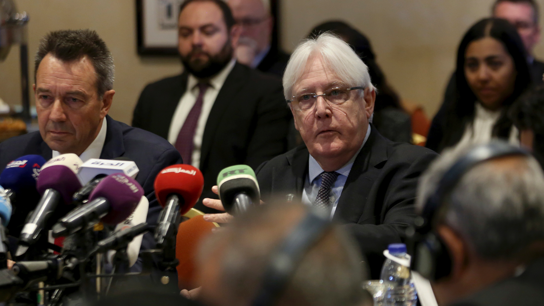FILE - In this Tuesday, Feb. 5, 2019 file photo, United Nations Special Envoy to Yemen Martin Griffiths, center, and President of the International Committee of the Red Cross Peter Maurer, participate in a new round of talks by Yemen's warring parties in Amman, Jordan. Yemeni security officials said sunday, Feb. 17, 2019, that Griffiths arrived in the Yemeni capital, Sanaa, to discuss the "complex situation" in and around the key port city of Hodeida. (AP Photo/Raad Adayleh, File)