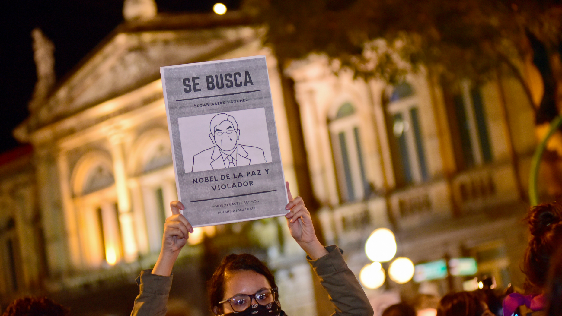 A woman holds up a sign with a line drawing depicting Costa Rica’s ex-President Oscar Arias and a message that reads in Spanish: “WANTED: Oscar Arias Nobel Peace Prize laureate and Violator”, during a protest by women activists under the slogan "Yo te creo," or "I believe you,” in San Jose, Costa Rica, Friday Feb. 8, 2019. At least five women have accused Arias of actions ranging from unwelcome fondling or sexual innuendo to sexual assault. (AP Photo/Carlos Gonzalez)