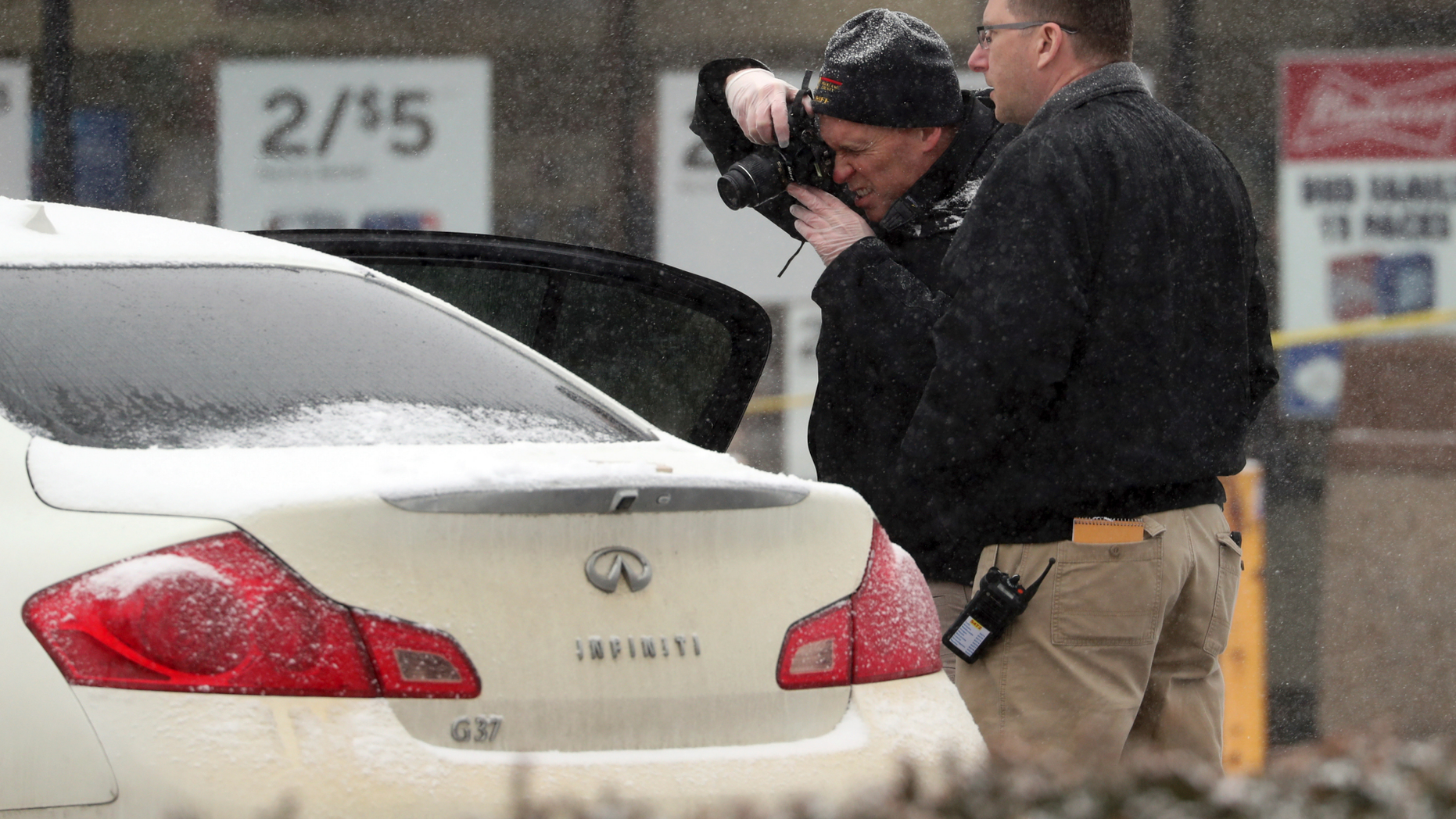 The investigators photographed a vehicle in front of a convenience store in Garnerville, New York on Wednesday, February 20, 2019, after the vehicle allegedly struck and injured several people, including five children. Police said the driver of the vehicle was arrested for interrogation. (Peter Carr / The News magazine via AP)
