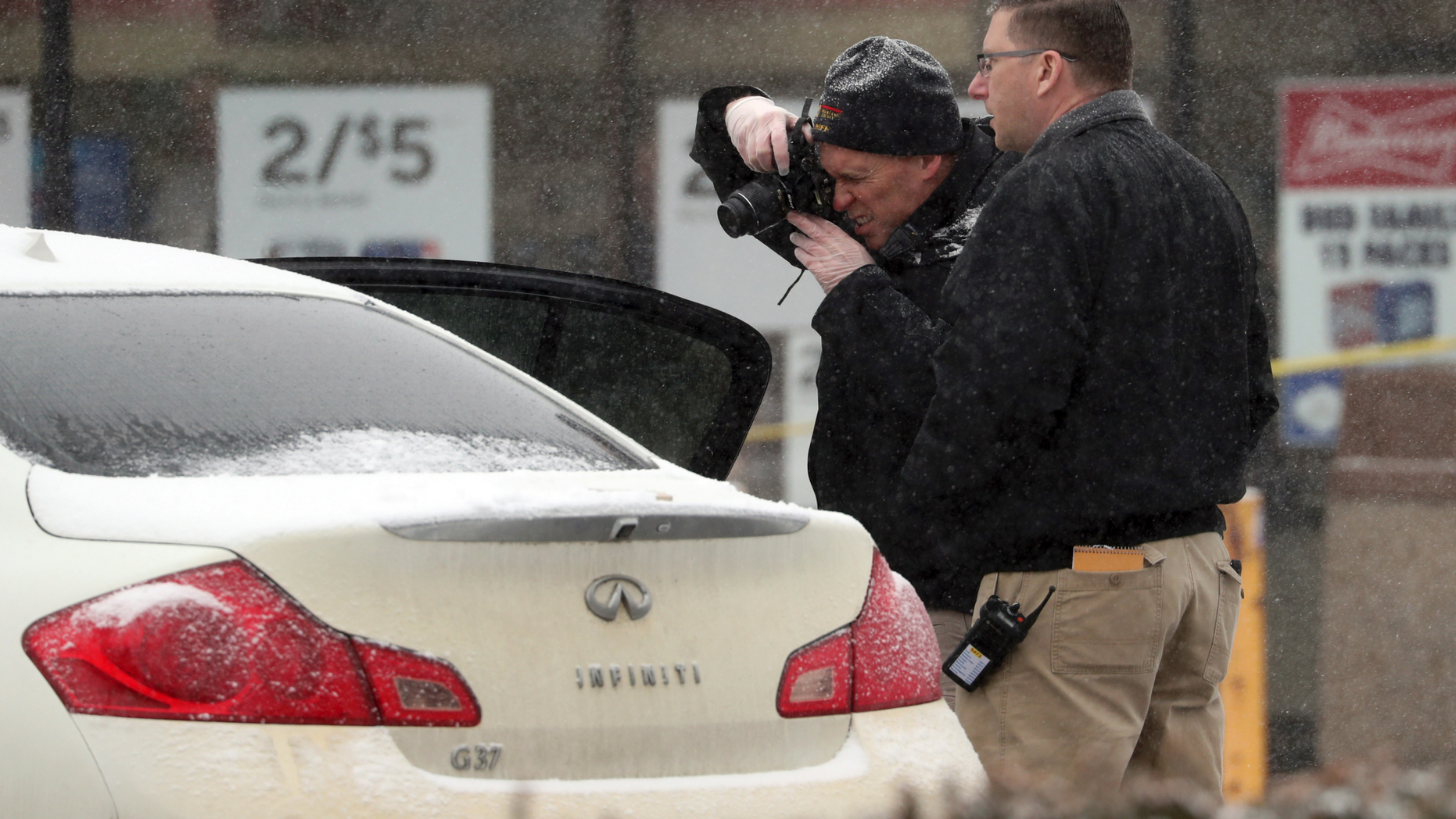 The investigators photographed a vehicle in front of a convenience store in Garnerville, New York on Wednesday, February 20, 2019, after the vehicle allegedly struck and injured several people, including five children. Police said the driver of the vehicle was arrested for interrogation. (Peter Carr / The News magazine via AP)