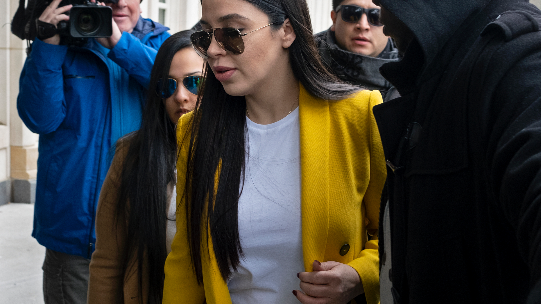 Emma Coronel Aispuro, center, wife of Joaquin "El Chapo" Guzman, arrives at federal court, Monday, Feb. 11, 2019, in New York. A jury is deliberating at the U.S. trial of the infamous Mexican drug lord. (AP Photo/Craig Ruttle)