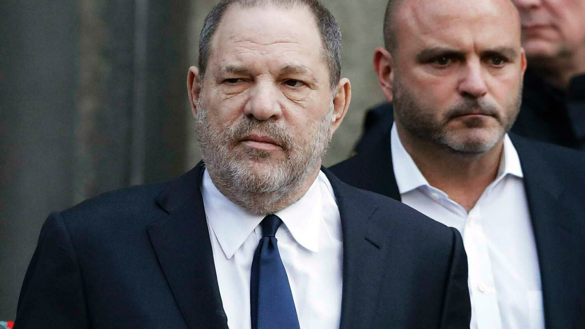 FILE - In this Thursday, Dec. 20, 2018, file photo, Harvey Weinstein, center, leaves New York Supreme Court in New York. Weinstein's sexual assault trial in New York City is being delayed until June 3, 2019. Court spokesman Lucian Chalfen confirmed the delay on Monday, Feb. 18, 2019. (AP Photo/Mark Lennihan, File)