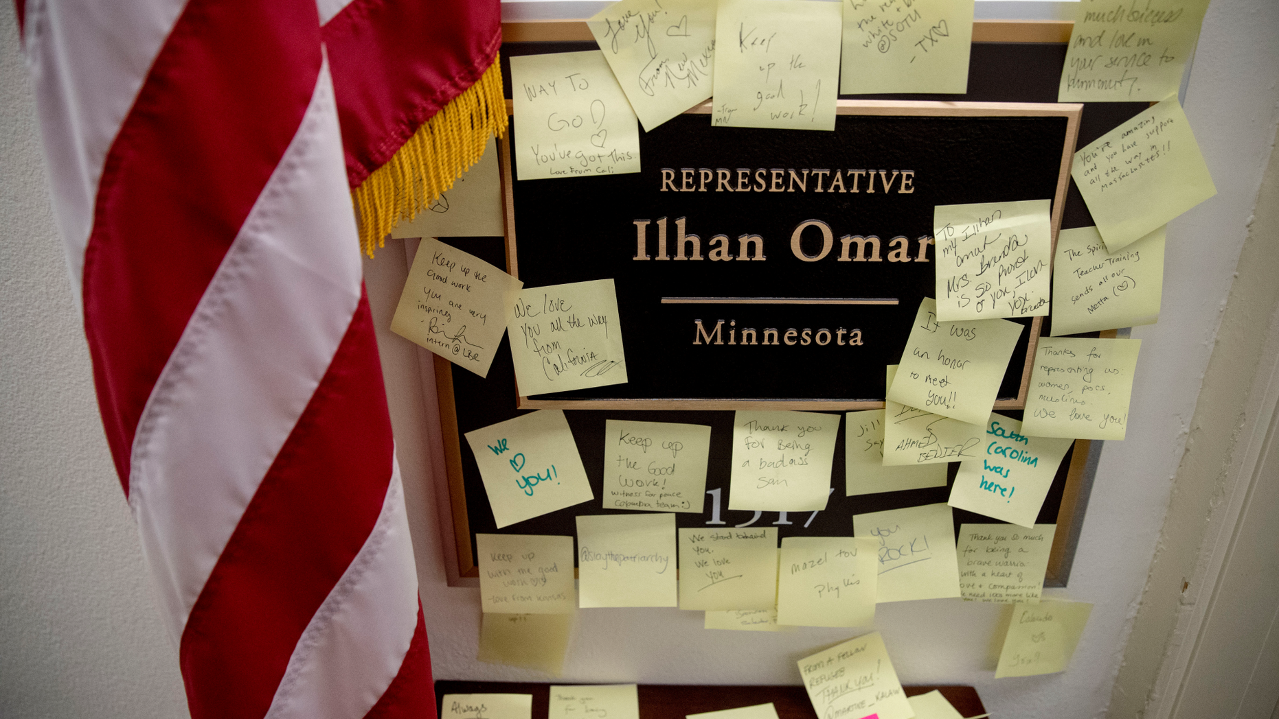 People leave post-it notes of support outside the office of Rep. Ilhan Omar, D-Minn., on Capitol Hill, Monday, Feb. 11, 2019, in Washington. Omar has "unequivocally" apologized for tweets suggesting a powerful pro-Israel interest group paid members of Congress to support Israel. Earlier Monday, House Speaker Nancy Pelosi and other Democrats had rebuked her for the tweets. (AP Photo/Andrew Harnik)