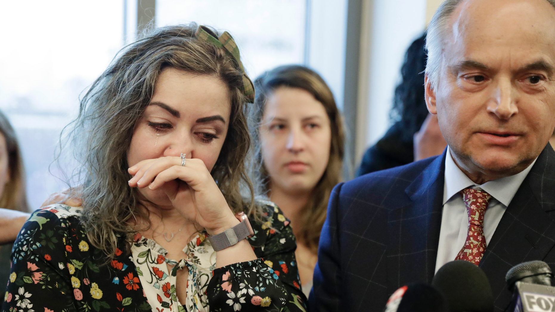 HOMICIDE RESEARCH, NOT HOMIC CRIMINAL - RaDonda Vaught, left, wipes tears as her lawyer, Peter Strianse, right, talks with reporters after a hearing on Wednesday February 20, 2019, in Nashville, Tennessee. Vaught nurse at Vanderbilt University Medical Center, is charged with reckless homicide after the death of a patient by a medication error. (AP Photo / Mark Humphrey)