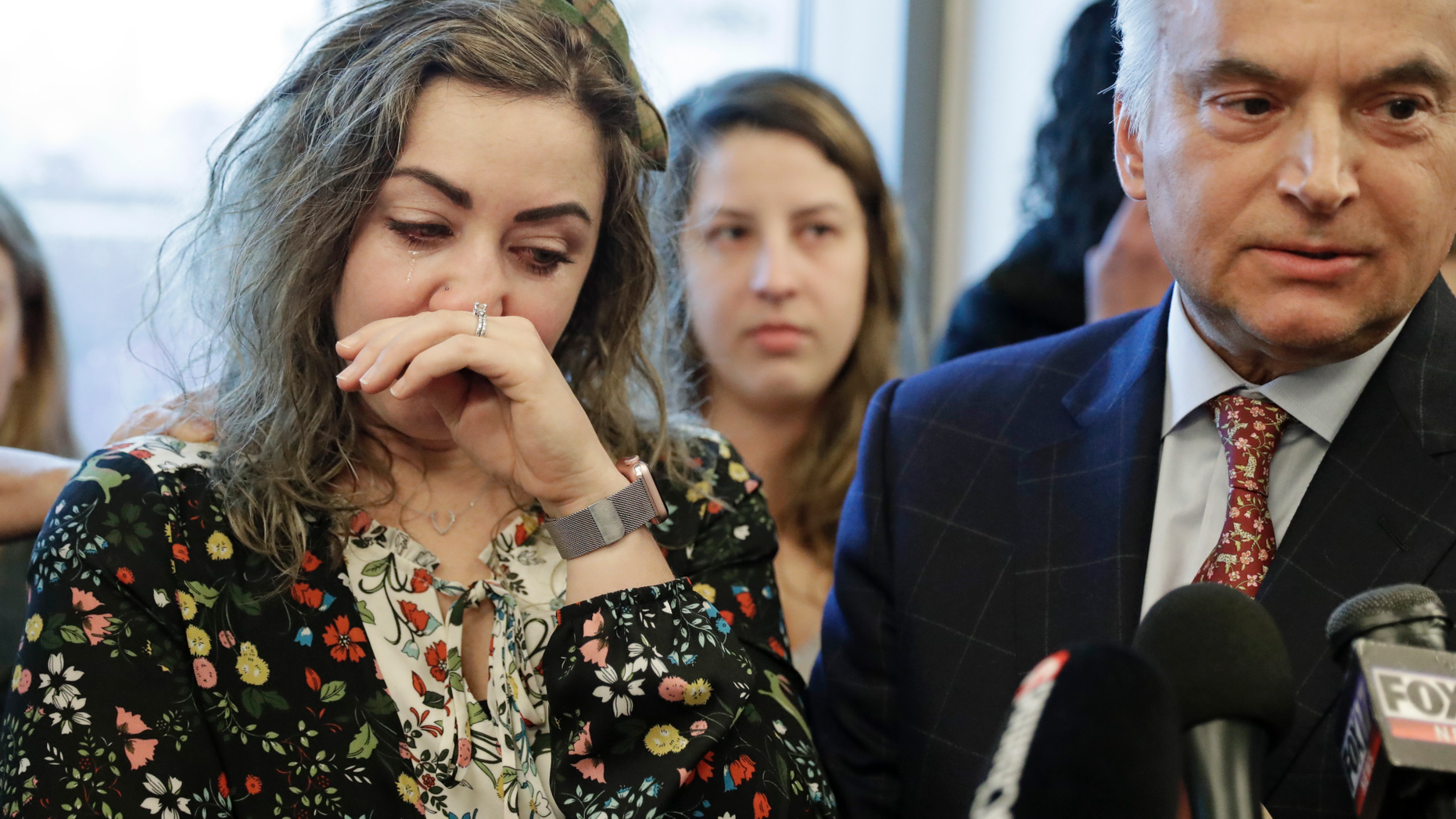 HOMICIDE RESEARCH, NOT HOMIC CRIMINAL - RaDonda Vaught, left, wipes tears as her lawyer, Peter Strianse, right, talks with reporters after a hearing on Wednesday February 20, 2019, in Nashville, Tennessee. Vaught nurse at Vanderbilt University Medical Center, is charged with reckless homicide after the death of a patient by a medication error. (AP Photo / Mark Humphrey)