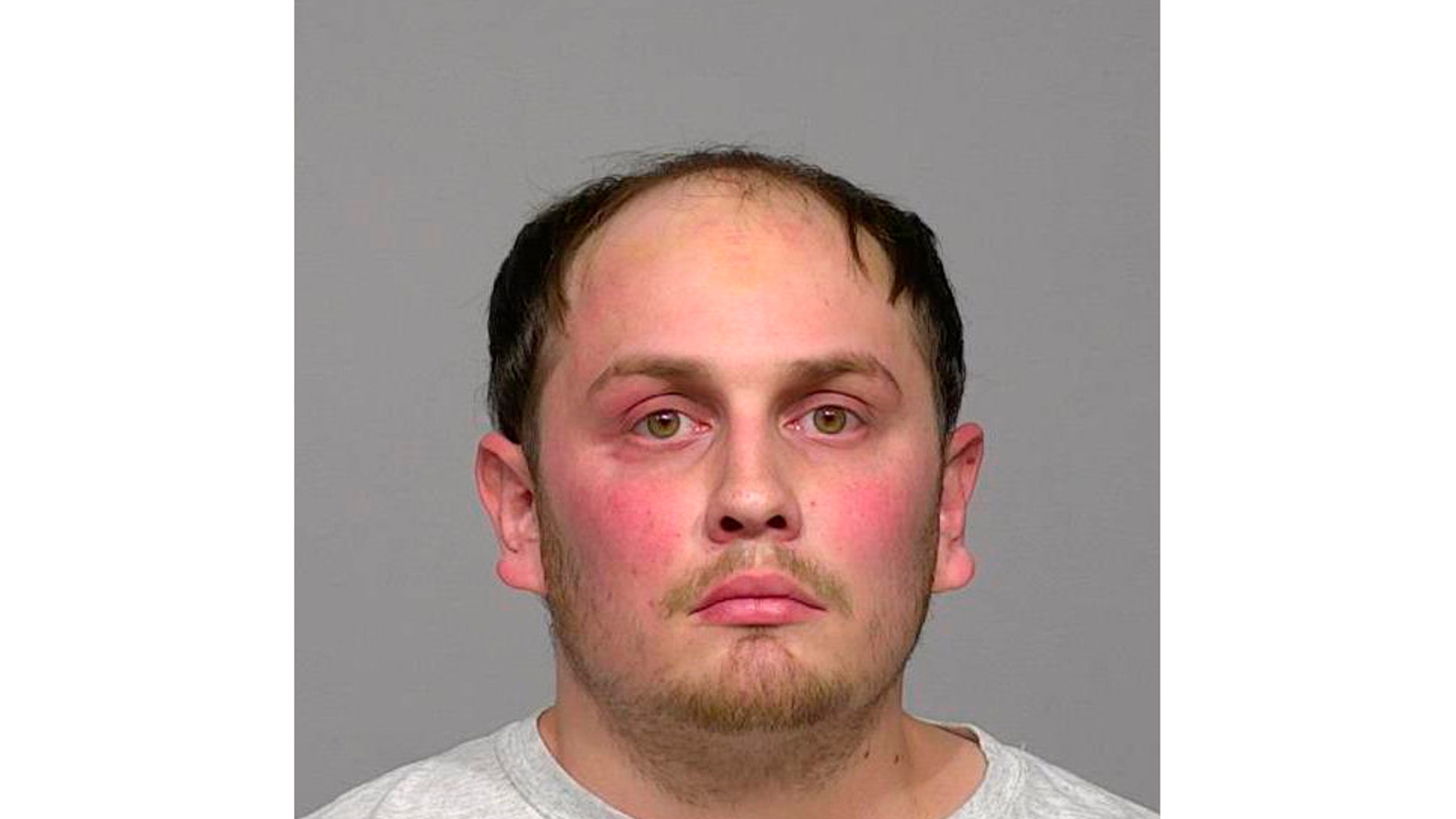 This undated image provided by the Milwaukee County Jail shows Jordan Fricke. On Sunday, Feb. 10, 2019, Fricke was charged with first-degree intentional homicide and other crimes in the fatal shooting Wednesday of Officer Matthew Rittner, who was serving a search warrant. (Milwaukee County Jail via AP)