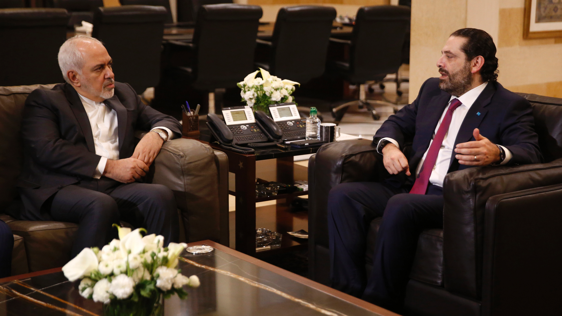 Lebanese Prime Minister Saad Hariri, right, meets with Iran's Foreign Minister Mohammad Javad Zarif, at the government palace, in Beirut, Lebanon, Monday, Feb. 11, 2019. Zarif extended an offer for Iranian military assistance to the U.S.-backed Lebanese army on Sunday, saying Iran is ready to assist in all sectors should the Lebanese government want it. (AP Photo/Hussein Malla)