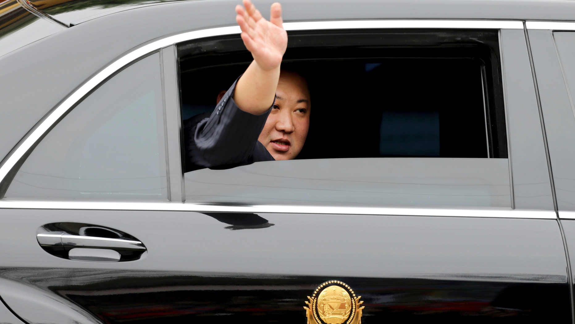 North Korean leader Kim Jong Un waves from a car after arriving by train in Dong Dang in a Vietnamese border town last month, ahead of his second summit with President Trump. (AP Photo/Minh Hoang)