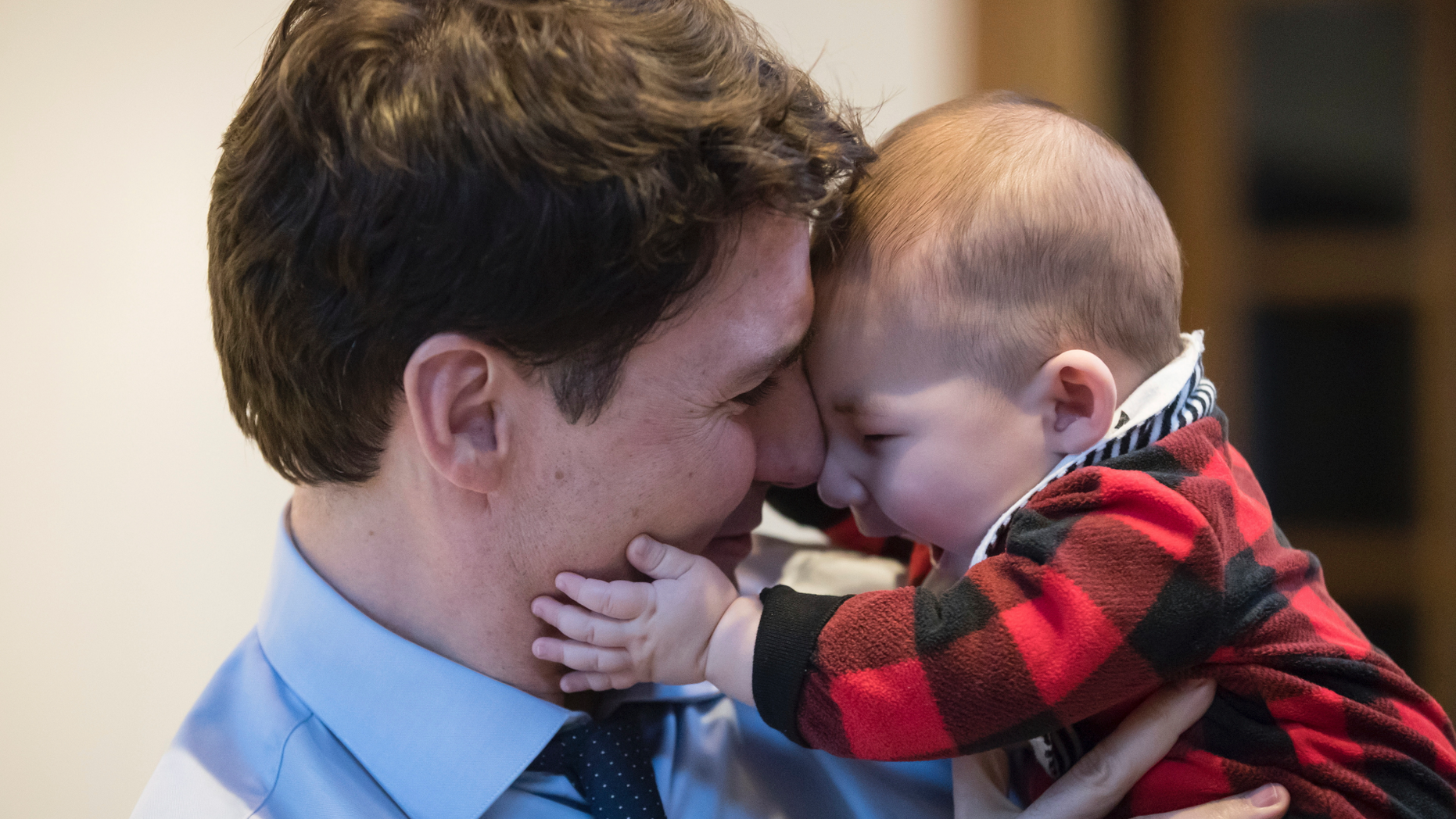 Prime Minister Justin Trudeau holds Jack Golden, six-months-old, while campaigning with Richard T. Lee, the Liberal candidate in the Burnaby South byelection, at a cafe in Burnaby, British Columbia, Monday, Feb. 11, 2019. Federal byelections will be held on Feb. 25 in three vacant ridings - Burnaby South, where NDP Leader Jagmeet Singh is hoping to win a seat in the House of Commons, the Ontario riding of York-Simcoe and Montreal's Outremont. (Darryl Dyck/The Canadian Press via AP)