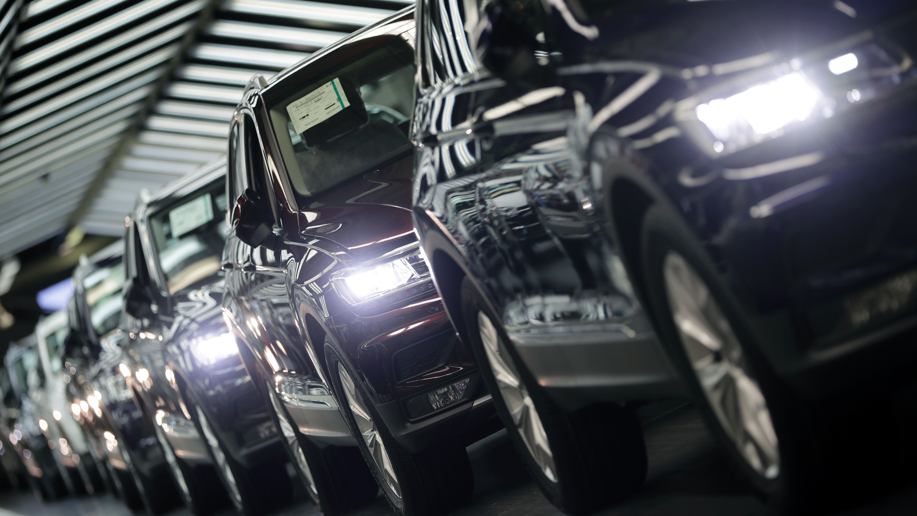 FILE - In this March 8, 2018 file photo photo Volkswagen cars are pictured during a final quality control at the Volkswagen plant in Wolfsburg, Germany. Germany's economic growth has stagnated in the last three months of the year. (AP Photo/Michael Sohn, file)