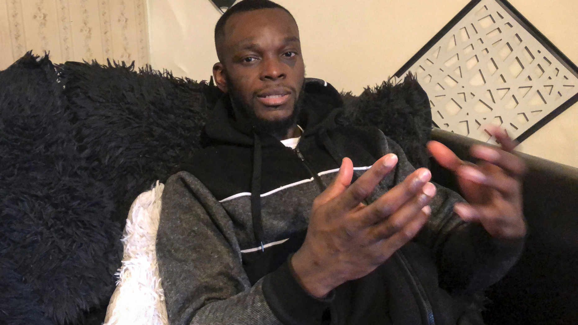 FILE - In this Dec. 31, 2018, file photo taken in in Delaware, Ohio, Shamieke Pugh discusses injuries he suffered in 2017 when a fellow inmate at the Southern Ohio Correctional Facility in Lucasville slipped out of his cuffs and allegedly stabbed Pugh and three other inmates multiple times as they sat handcuffed to a table and were unable to defend themselves. A pretrial hearing was scheduled for Tuesday, Feb. 12, 2019, for inmate Greg Reinke, who is accused in the 2017 knife attack on four other prisoners, and a 2018 stabbing attack on a guard who is still recovering from his injuries. (AP Photo/Andrew Welsh-Huggins, File)