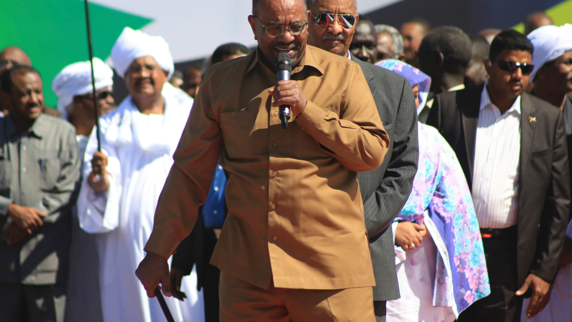 FILE - In this Jan. 9, 2019 file photo, Sudan's President Omar al-Bashir addresses supporters at a rally in Khartoum, Sudan. On Tuesday, Feb 12, 2019, hundreds of demonstrators are gathering in different Sudanese cities, protesting against autocratic al-Bashir. The demonstrations, were called by the Sudanese Professionals Association, an umbrella of independent professional unions. Video footage shows demonstrators gathering at intersections chanting "just fall," and calling for a "people's revolution." (AP Photo/Mahmoud Hjaj, File)