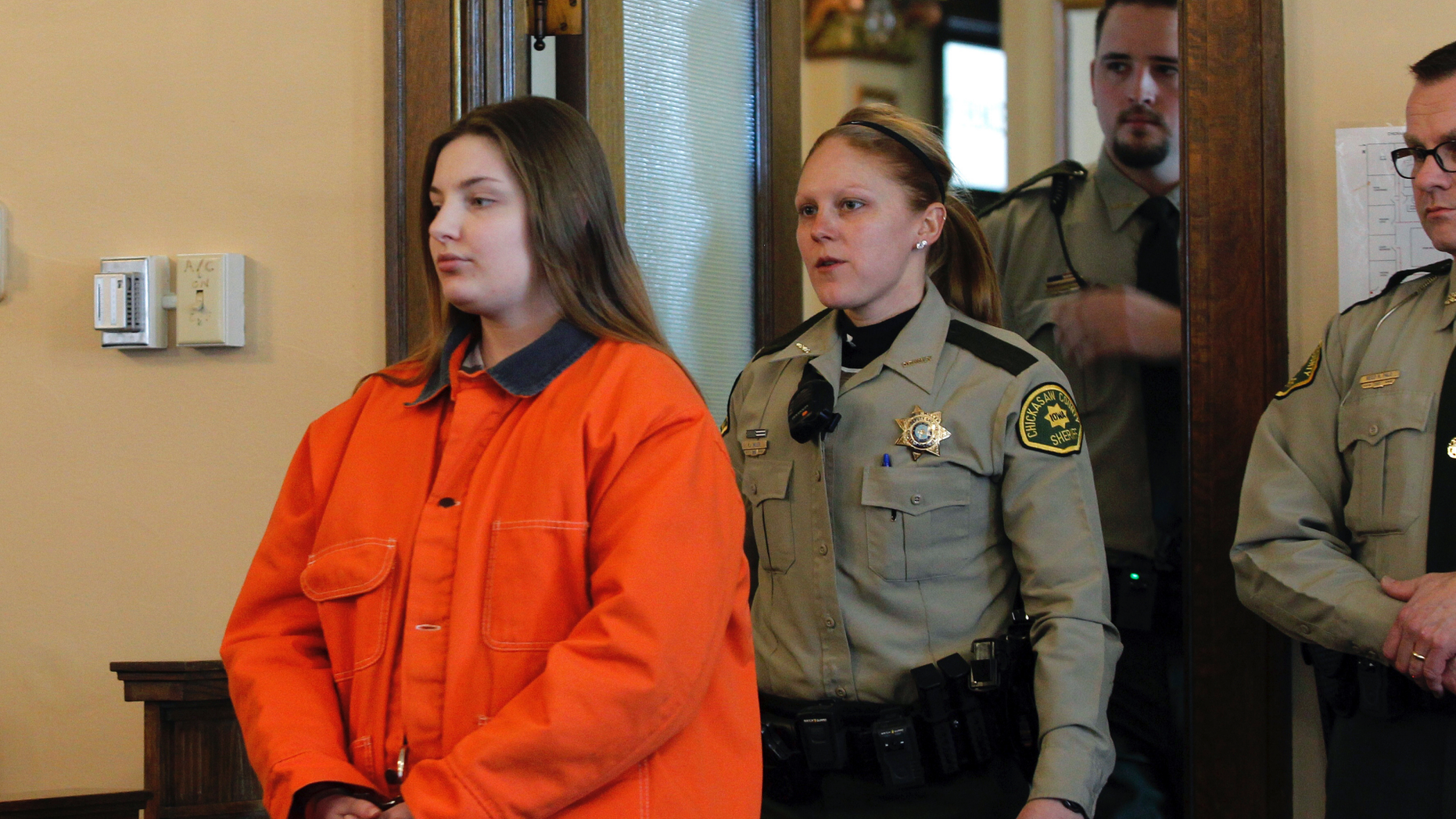 Cheyanne Renae Harris, left, enters the courtroom prior to sentencing Tuesday, Feb. 19, 2019, in New Hampton, Iowa. The Iowa woman whose infant son's lifeless body was found in a baby swing has been imprisoned for life without possibility of parole. Court records say Harris was sentenced to the state-mandated penalty, and her request for a new trial was denied. The charges stem from the death of 4-month-old Sterling Koehn, whose body was found Aug. 30, 2017, in a maggot-infested diaper at an apartment in Alta Vista. (Jeff Reinitz/The Courier via AP)