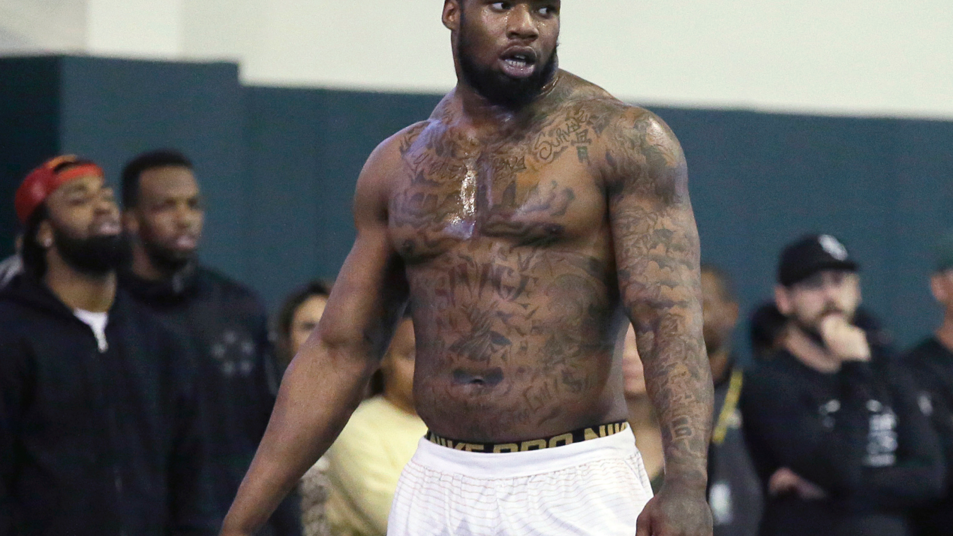 FILE - In this March 16, 2016, file photo, Shawn Oakman pauses during drills for NFL scouts at Baylor's Pro Day football workout in Waco, Texas. Prosecutors in Texas have rested their case in the trial of the former Baylor University football player accused of raping another student in 2016. The prosecution rested Thursday, Feb. 28, 2019, just a day after opening statements in the trial. Oakman's attorney contend the two had consensual sex. (AP Photo/LM Otero, File)