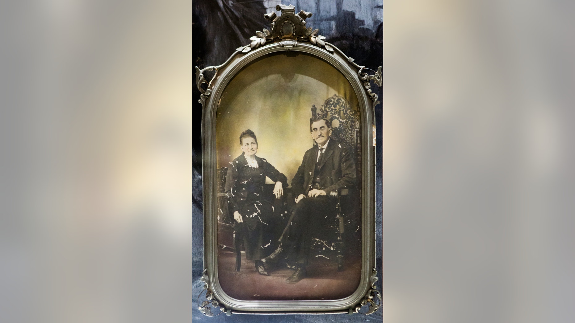 FILE - This June 9, 2015 file photo shows a portrait of Sheriff Pat Garrett with his wife at the Bryan Museum in Galveston, Texas. This June 9, 2015 file photo shows a portrait of Sheriff Pat Garrett with his wife at the Bryan Museum in Galveston, Texas. Officials in Las Cruces, N.M. are balking at the idea of renaming a street after the 19th century Old West sheriff who shot and killed the outlaw Billy the Kid. (Marie D. De Jesus/Houston Chronicle via AP, File) (Marie D. De Jesus/Houston Chronicle via AP, File)