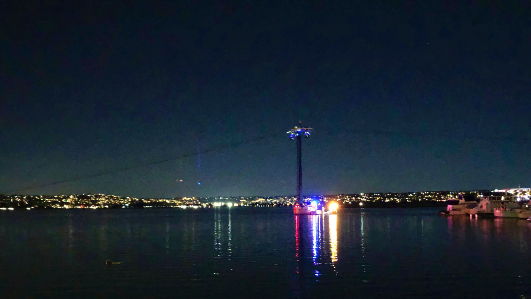 On this photo provided by Kasia Gregorczyk, more than a dozen people are stuck in a stroll at SeaWorld on Monday, February 18, 2019 in San Diego. San Diego police told FOX5 News that nearly six gondolas had stopped working Monday night after a breaker tripped 