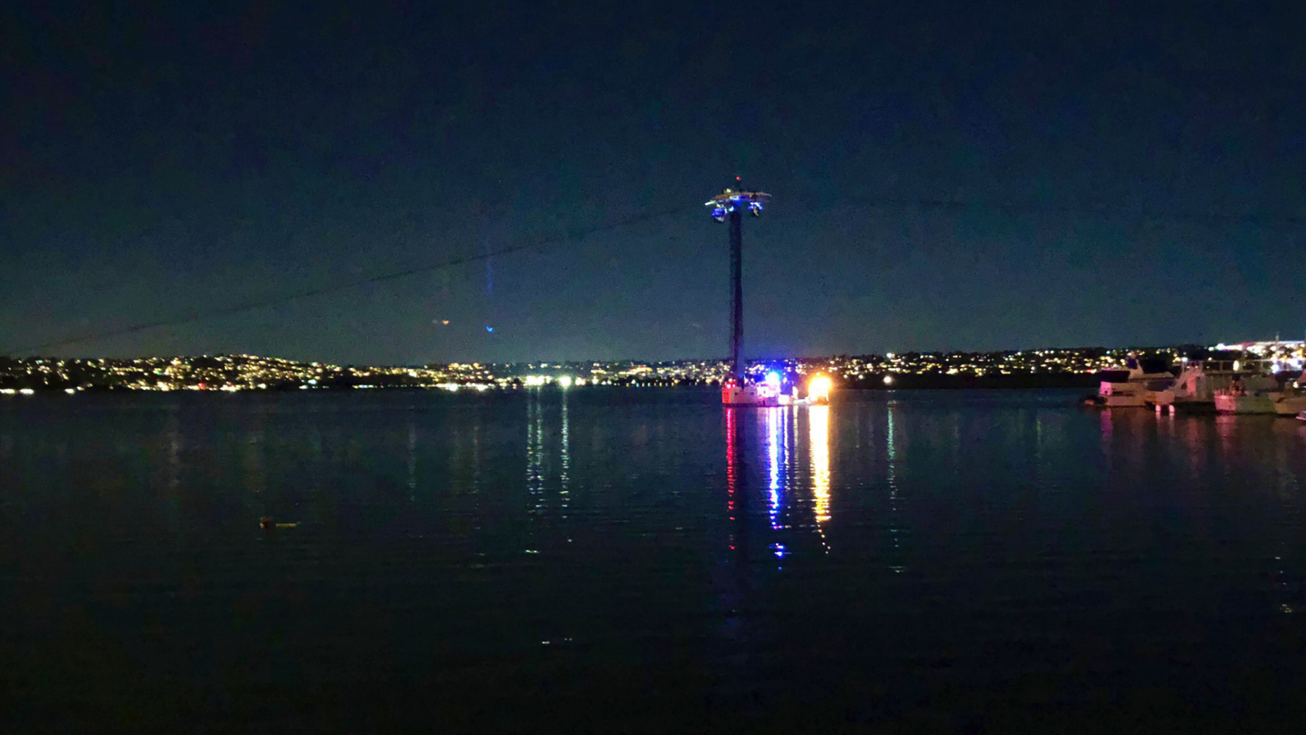 On this photo provided by Kasia Gregorczyk, more than a dozen people are stuck in a stroll at SeaWorld on Monday, February 18, 2019 in San Diego. San Diego police told FOX5 News that nearly six gondolas had stopped working Monday night after a breaker tripped 