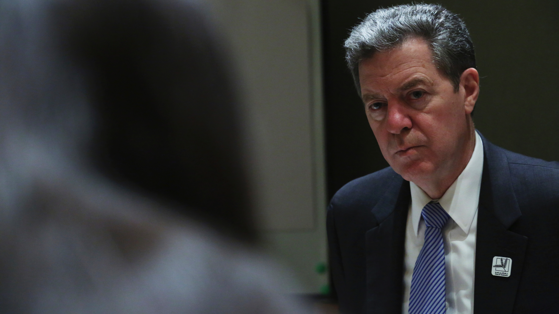 Sam Brownback, the U.S. ambassador-at-large for international religious freedom, speaks to journalists in Abu Dhabi, United Arab Emirates, Sunday, Feb. 24, 2019. Pakistan has "a desire to change" its ways and be removed from an American blacklist of countries that infringe religious freedoms, Brownback said Sunday on a tour of a Mideast long riven by faith. (AP Photo/Jon Gambrell)