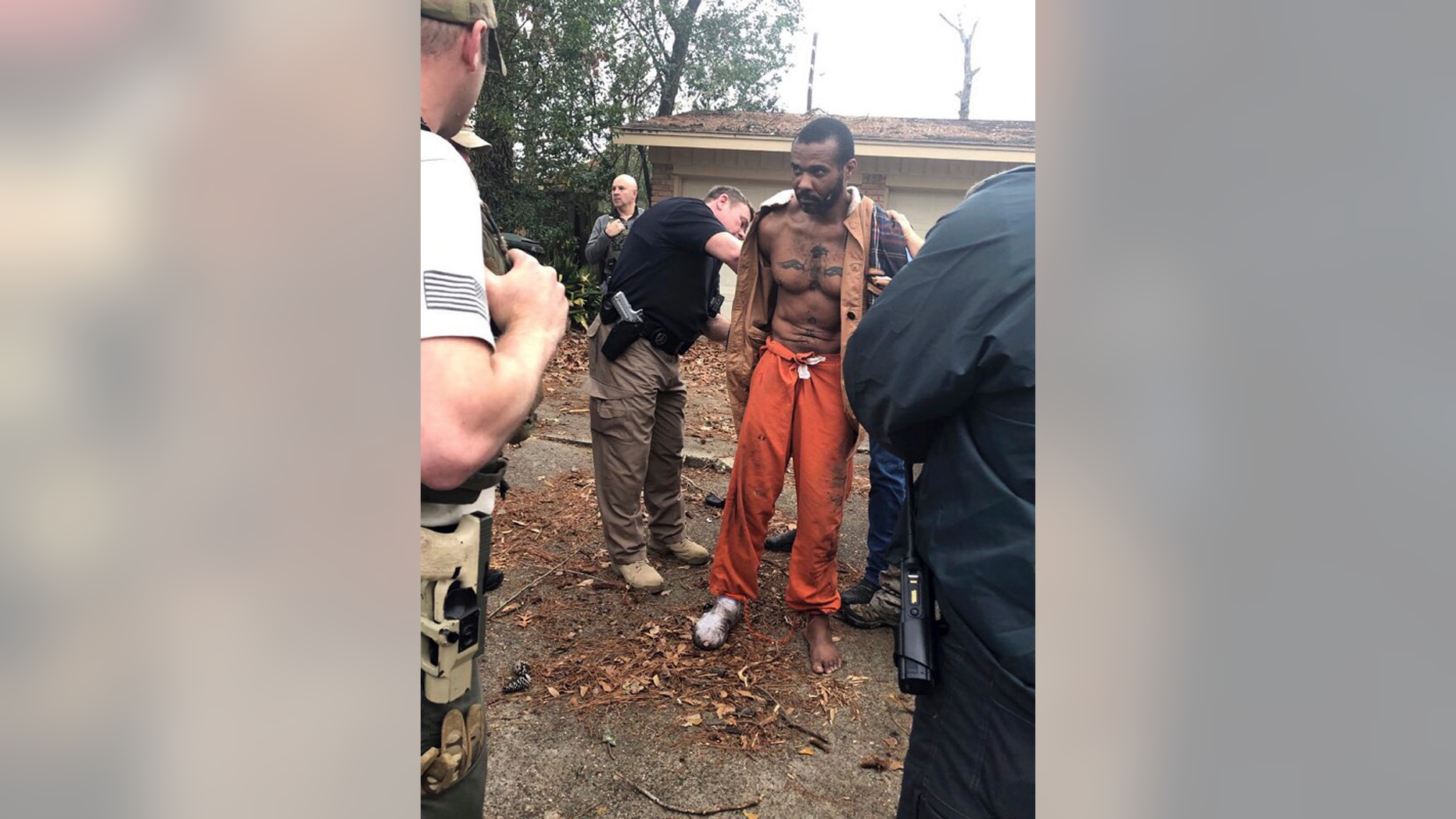 FILE - This Feb. 3, 2019 photo released by the Conroe Police Department shows Cedric Marks being captured after nine-hour manhunt that began when he escaped from a prisoner transport van in Conroe, Texas. A private prisoner transport company has told Texas officials it is shutting down after an MMA fighter accused of two murders escaped from its van last week. (Conroe Police Department via AP)