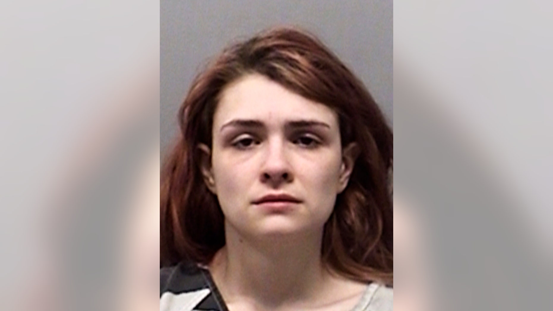 FILE - This undated photo provided by the From Wise County Sheriff's Office shows Paige Isabow Harkings. A North Texas judge says four young siblings will remain in foster care after two were discovered locked in a dog cage and the others were found smeared with excrement in a barn. Harkings has been jailed on child endangerment charges The judge ruled Wednesday, Feb. 27, 2019, that no suitable relatives could be found to care for the children, who range in age from 1 to 5 years old. ( Wise County Sheriff's Office via AP, File)