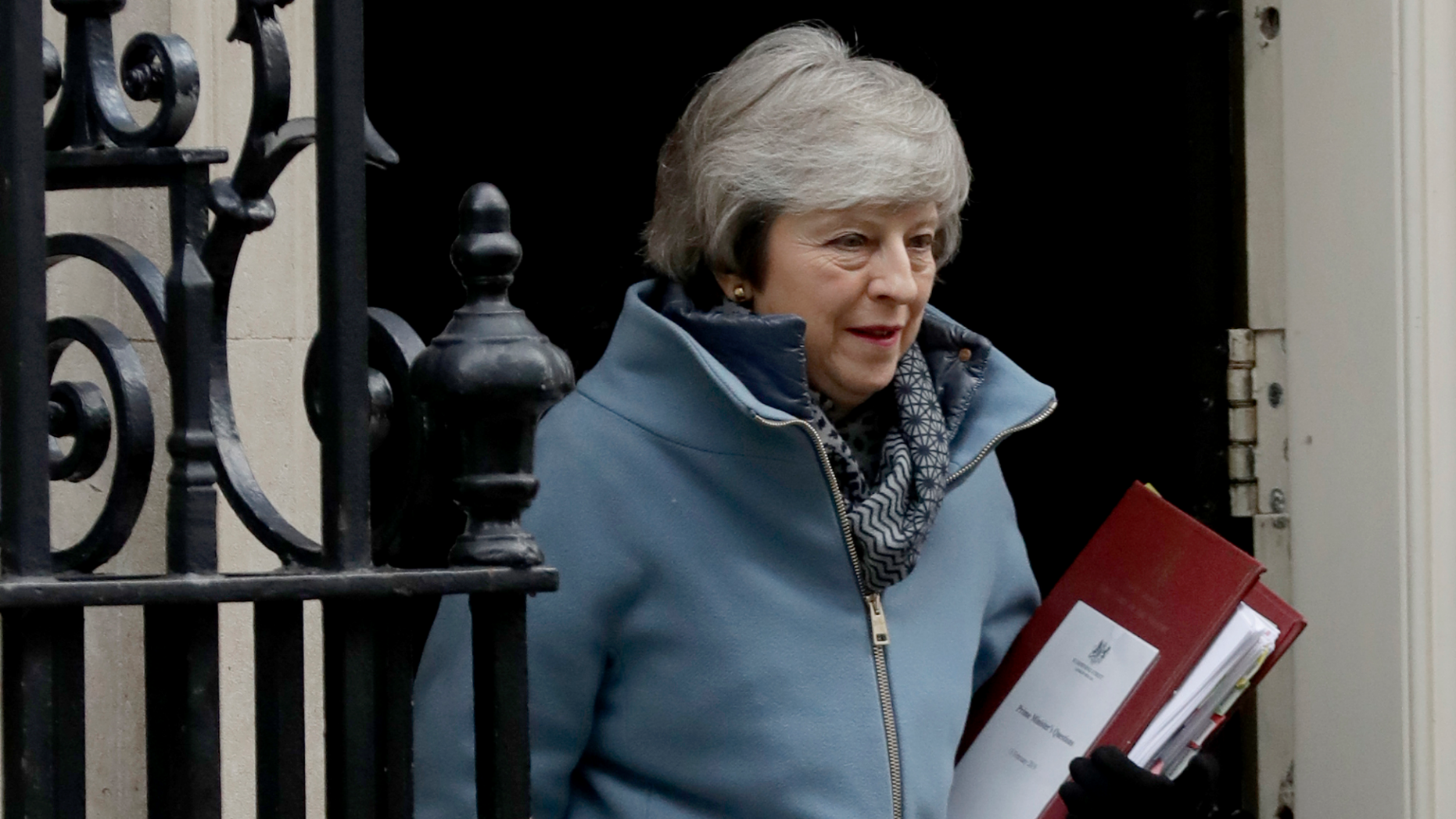 British Prime Minister Theresa May leaves 10 Downing Street in London, to attend Prime Minister's Questions at the Houses of Parliament, Wednesday, Feb. 13, 2019. (AP Photo/Matt Dunham)