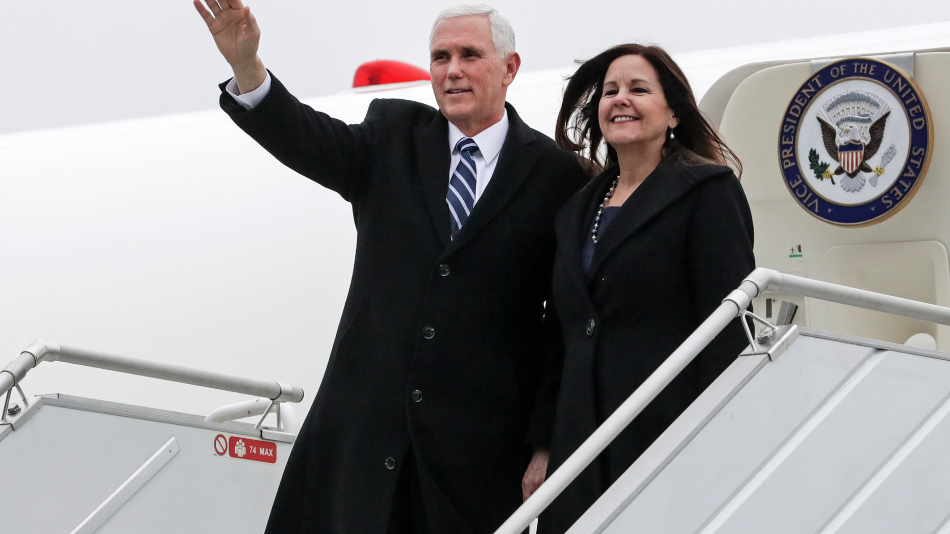 United States Vice President Mike Pence and his wife Karen Pence arrive at the airport in Warsaw, Poland, Wednesday, Feb. 13, 2019. The Polish capital is host for a two-day international conference on the Middle East, co-organized by Poland and the United States. (AP Photo/Michael Sohn)