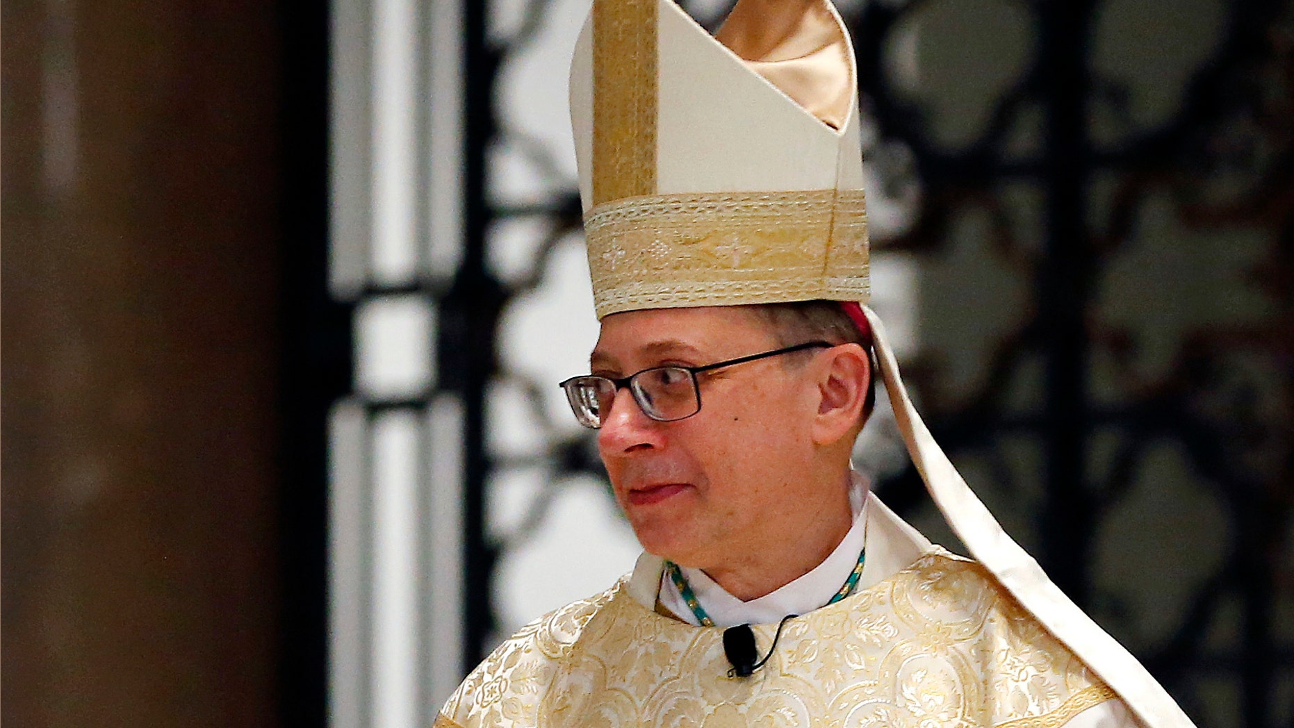FILE - This Jan. 12, 2018, file photo shows Bishop Barry Knestout during his installation as the 13th bishop of the Catholic Diocese of Richmond at the Cathedral of the Sacred Heart in Richmond, Va. Virginia's Catholic Diocese of Richmond on Wednesday, Feb. 13, 2019, published a list of 42 priests with a "credible and substantiated" allegation of sexual abuse against a child. (Mark Gormus/Richmond Times-Dispatch via AP, File)
