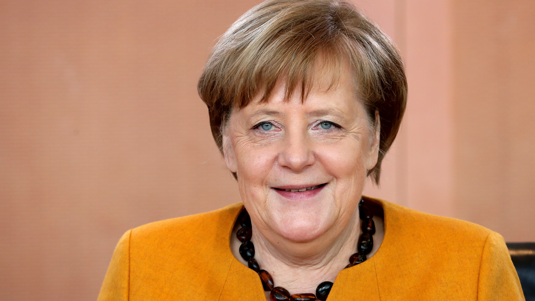 German Chancellor Angela Merkel smiles as she arives for the weekly cabinet meeting at the Chancellery in Berlin, Germany, Wednesday, Feb. 27, 2019. (AP Photo/Michael Sohn)