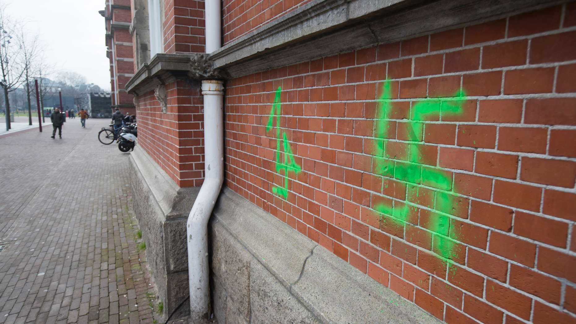 A Swastika, painted on the wall of the Stedelijk Museum overnight, is seen in Amsterdam, Netherlands, Friday, Feb. 22, 2019. Vandals suspected of being football hooligans from The Hague have daubed graffiti including swastikas and anti-Semitic texts on buildings in Amsterdam. The graffiti were discovered Friday, ahead of a match Sunday between ADO and Amsterdam powerhouse Ajax. Ajax fans are banned from attending the match following previous clashes between fans of the two clubs. (AP Photo/Peter Dejong)