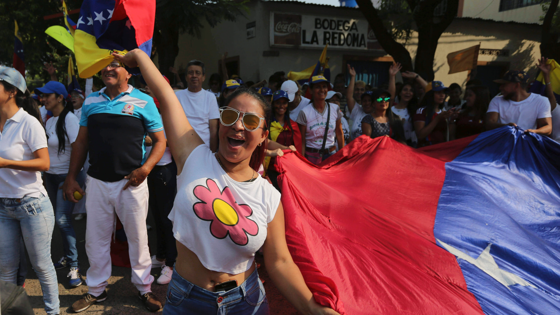 A woman shouts slogans against Venezuela's President Nicolas Maduro during a protest against his government in Urena, Venezuela, Tuesday, Feb. 12, 2019. Nearly three weeks after the Trump administration backed an all-out effort to force out President Nicolas Maduro, the embattled socialist leader is holding strong and defying predictions of an imminent demise. (AP Photo/Fernando Llano)