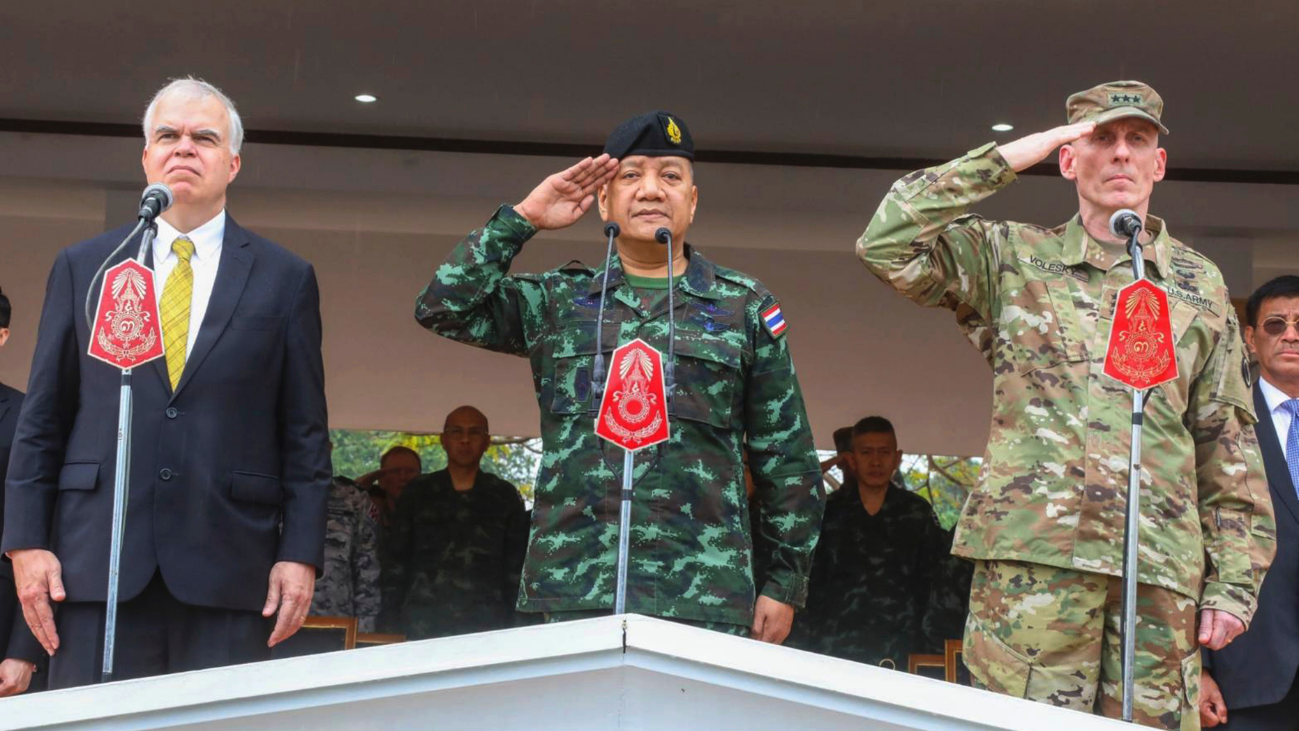 In this photo by release Royal Thai Armed Forced Headquarters, from left; acting U.S. ambassador Peter Haymond, The Royal Thai Armed Forces, Gen. Pornpipat Benyasri, Commander, and U.S. Army First Corps representing U.S. Indo-Pacific Command Lt. Gen. Gary J. Volesky salute during the opening ceremony of the joint military exercise Cobra Gold 2019, Phitsanulok Province, Thailand. Tuesday, Feb. 12, 2019. The exercise will take place from Feb. 12-22 focusing on military Field Training Exercise, Humanitarian Civic Assistance to communities and Humanitarian Assistance and Disaster Relief Exercise. (Royal Thai Armed Forced Headquarters via AP)