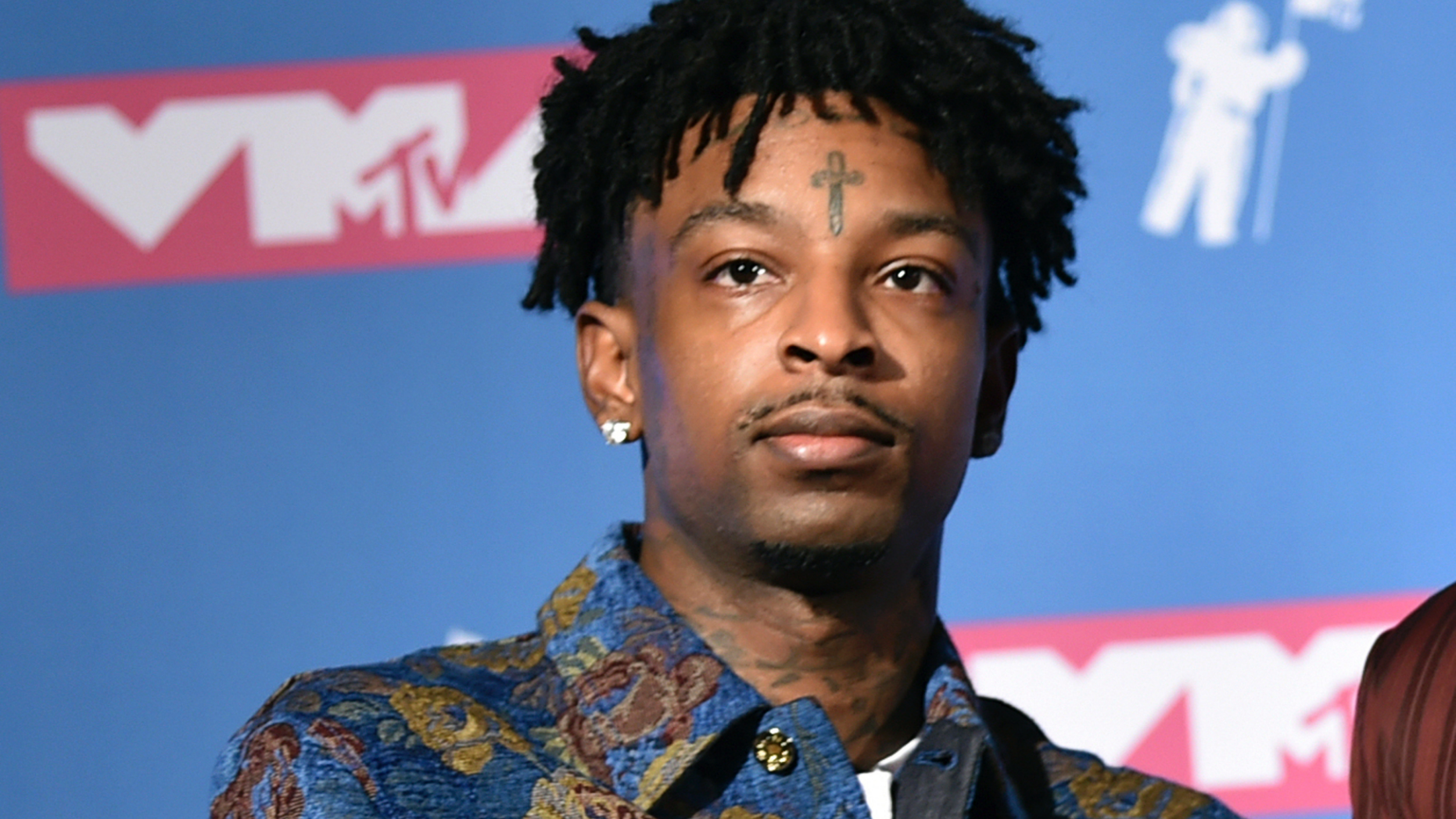 FILE - In this Aug. 20, 2018, file photo, 21 Savage poses in the press room at the MTV Video Music Awards at Radio City Music Hall in New York. A lawyer for 21 Savage says Wednesday, Feb. 13, 2019, that the Grammy-nominated rapper, whose given name is She'yaa Bin Abraham-Joseph, has been released on on $100,000 bond from the Irwin County Detention Center in Ocilla, Ga. (Photo by Evan Agostini/Invision/AP, File)