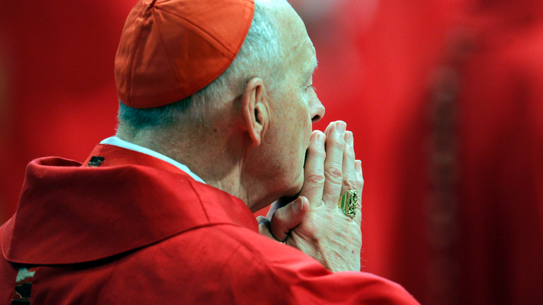FILE - In this Monday, April 18, 2005 file photo, U.S. Cardinal Theodore Edgar McCarrick attends a Mass in St. Peter's Basilica at the Vatican. On Saturday, Feb. 16, 2019 the Vatican announced Pope Francis defrocked former U.S. Cardinal Theodore McCarrick after Vatican officials found him guilty of soliciting for sex while hearing Confession. (AP Photo/Pier Paolo Cito, files)
