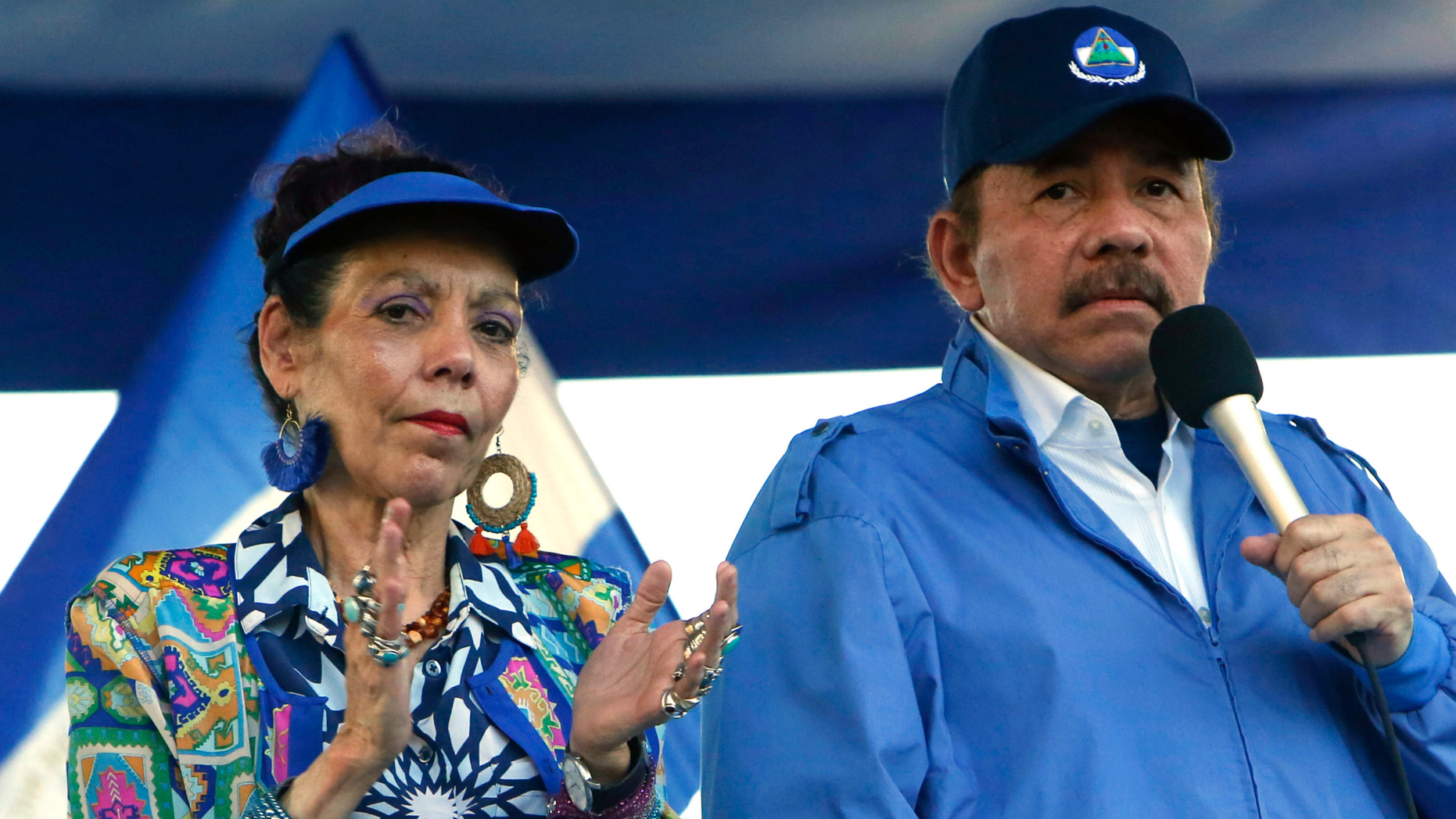 FILE - In this Sept. 5, 2018 file photo, Nicaragua's President Daniel Ortega and his wife, Vice President Rosario Murillo, lead a rally in Managua, Nicaragua. Despite the new Feb. 1, 2019 tax rises, Nicaragua has not seen a repeat of last year’s mass protests. And it seems unlikely to, since Ortega forcefully quashed the challenge to his power, including effectively outlawing opposition demonstrations since September. (AP Photo/Alfredo Zuniga, File)