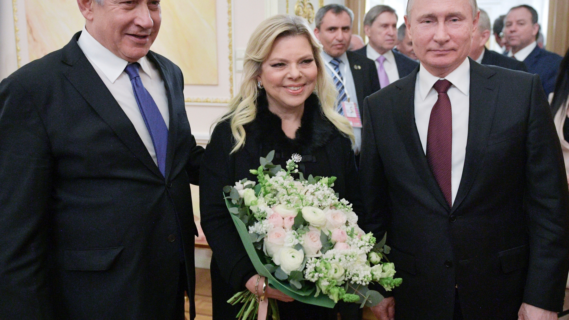 Russian President Vladimir Putin, right, Israeli Prime Minister Benjamin Netanyahu, and his wife Sara pose for a photo after talks in the Kremlin in Moscow, Russia, Wednesday, Feb. 27, 2019. Israel's prime minister vowed to prevent Iran from securing a lasting presence in Syria as he visited Moscow Wednesday for talks focusing on regional security. (Alexei Druzhinin, Sputnik, Kremlin Pool Photo via AP)