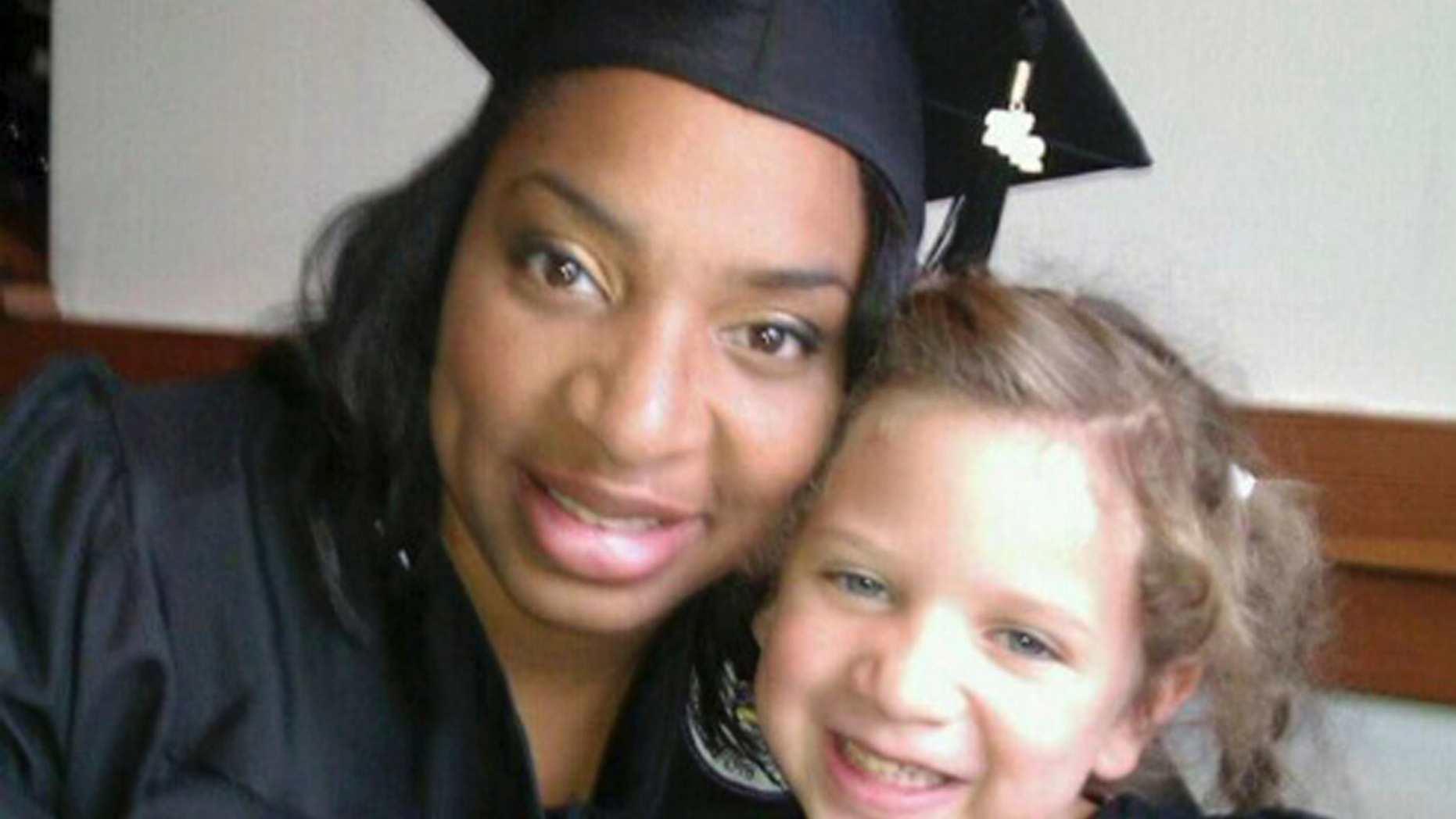 This undated selfie shows Amberkatherine DeCory with her daughter, Mila DeCory. Until her daughter could speak, Decory, a police officer who lives outside Minneapolis, carried her birth certificate and even a photo of her giving birth, just in case the African-American and Native American had to prove that her light-haired, blue-eyed child was truly her own. Families like theirs were not surprised when they heard that Cindy McCain reported a woman to police for possible human trafficking because McCain saw her at the airport with a toddler of a different ethnicity. (Amberkatherine DeCory via AP)