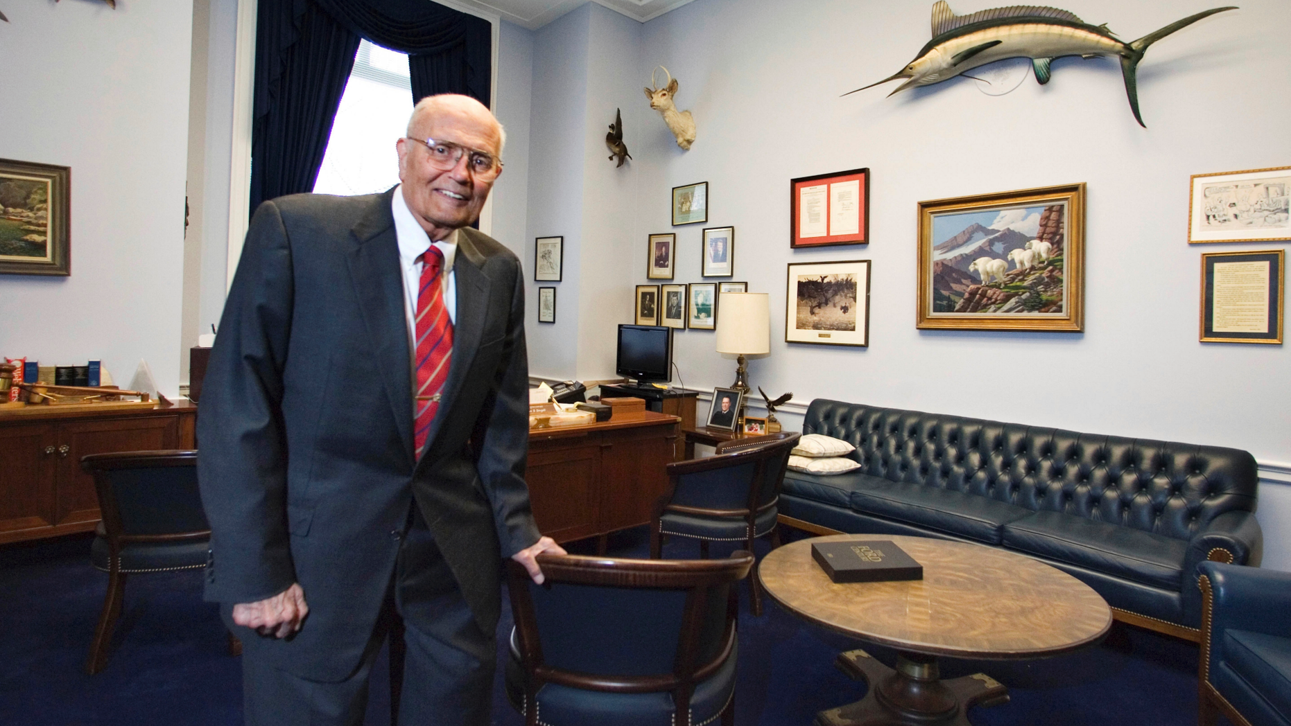 FILE- In a Feb. 4, 2009 file photo, Rep. John Dingell, D-Mich. poses for a photograph inside his office in House Rayburn Office Building on Capitol Hill in Washington. Dingell, the longest-serving member of Congress in American history who mastered legislative deal-making and was fiercely protective of Detroit's auto industry, has died at age 92. Dingell, who served in the U.S. House for 59 years before retiring in 2014, died Thursday, Feb. 7, 2019, at his home in Dearborn, said his wife, Congresswoman Debbie Dingell. (AP Photo/Manuel Balce Ceneta, File)