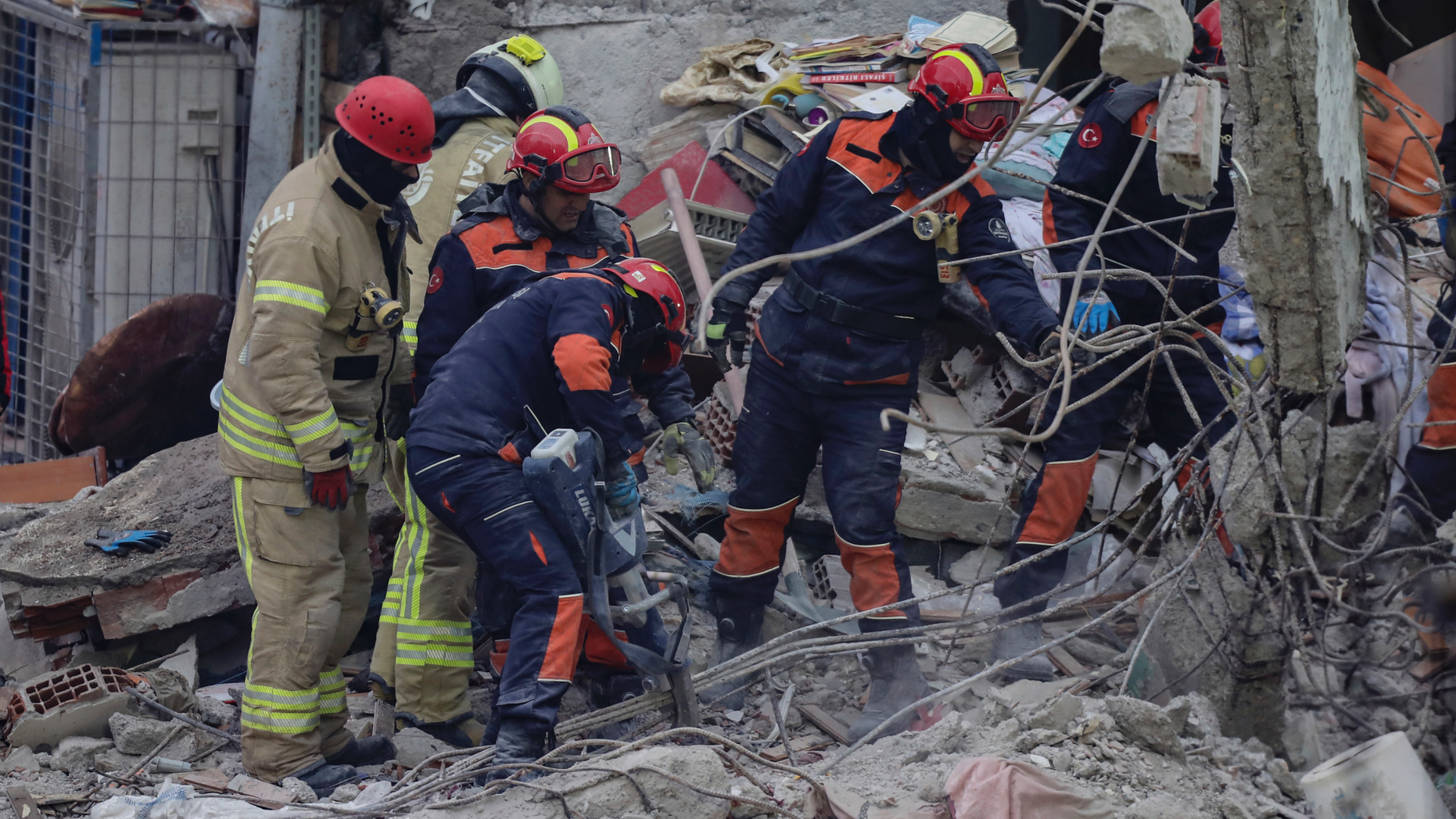 Rescue workers continue to remove rubble from an eight-story building which collapsed two days earlier in Istanbul, Friday, Feb. 8, 2019. Turkish rescue workers on Friday pulled out a 16-year-old boy from the rubble of an eight-story apartment building in Istanbul two days after it collapsed, Turkey's interior minister Suleyman Soylu said. (AP Photo/Emrah Gurel)