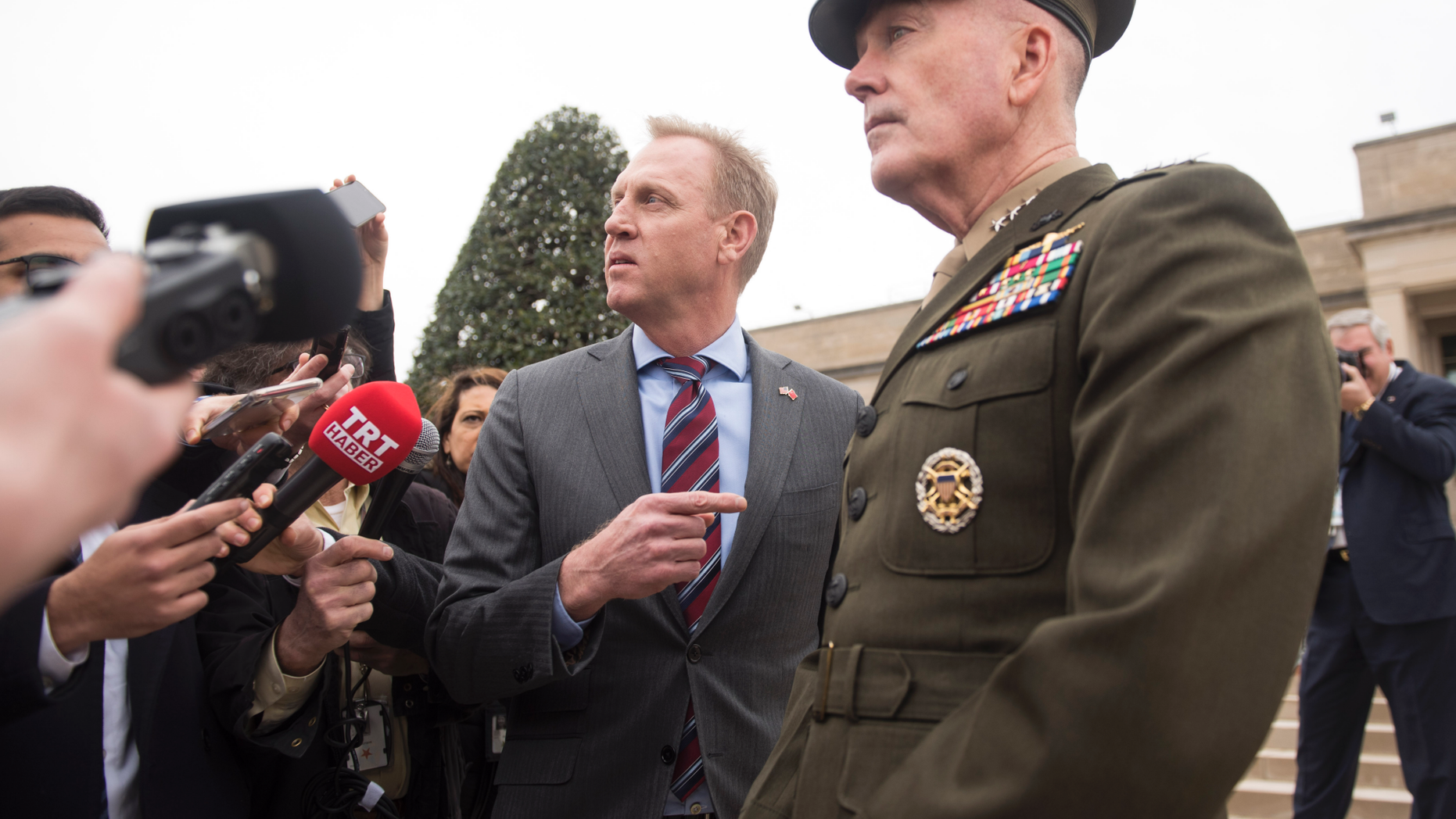 Acting Secretary of Defense Patrick Shanahan, center, and Chairman of the Joint Chiefs Gen. Joseph Dunford, right, talk to the press before the arrival of Turkish Defense Minister Hulusi Akar on Friday, Feb. 22, 2019 at the Pentagon in Washington. (AP Photo/Kevin Wolf)