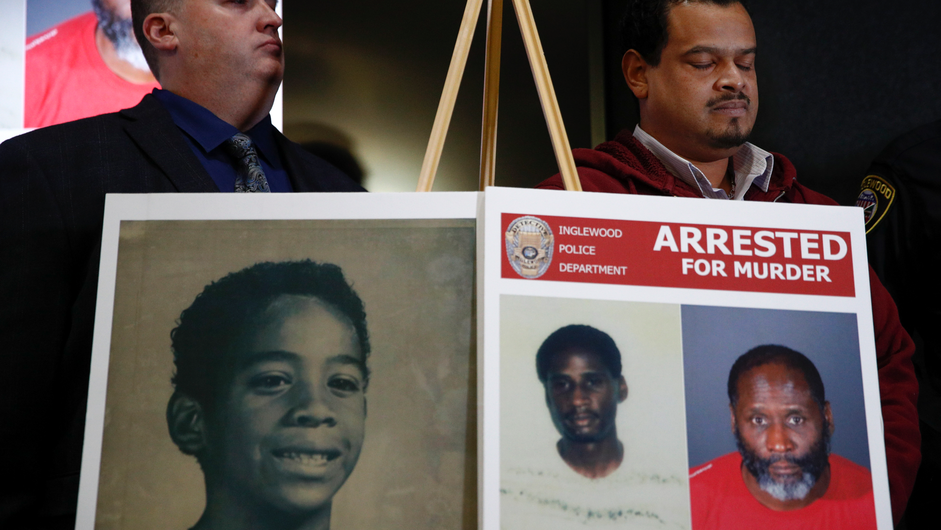 Hubert Tillett, right, brother of William Tillett, stands behind an exhibit showing his brother, at the bottom left, at a press conference on Wednesday, February 20, 2019 in Inglewood, California. Authorities say that a 50-year-old man is being held in connection with the kidnapping and murder of William Tillett, then 11, in southern California, there are nearly three decades. (AP Photo / Jae C. Hong)