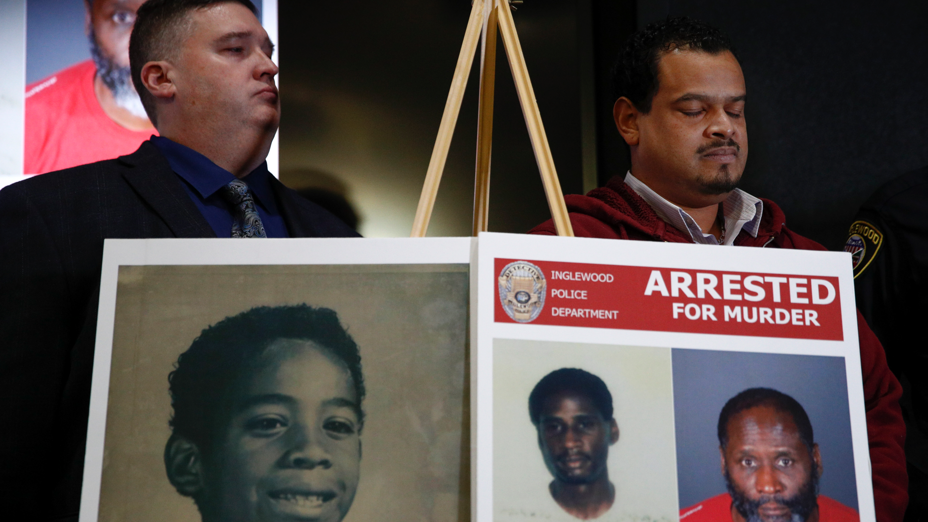 Hubert Tillett, right, brother of William Tillett, stands behind an exhibit showing his brother, at the bottom left, at a press conference on Wednesday, February 20, 2019 in Inglewood, California. Authorities say that a 50-year-old man is being held in connection with the kidnapping and murder of William Tillett, then 11, in southern California, there are nearly three decades. (AP Photo / Jae C. Hong)