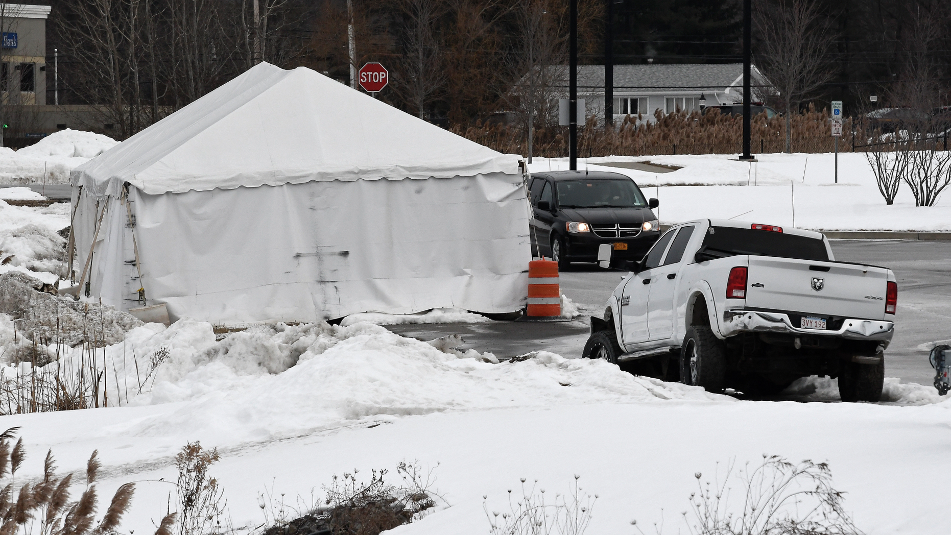 FILE - This Jan. 29, 2019, file photo shows a view of tent structure housing the wrecked limousine owned by Prestige Limousine involved in the Oct. 6, 2018, fatal accident in Schoharie County, behind the state police headquarters in Latham, N.Y. The National Transportation Safety Board's probe of a fatal limousine crash in upstate New York has not yet identified a cause, according to a preliminary report released Monday, Feb. 11, after weeks of wrangling between federal inspectors and a local prosecutor over access to physical evidence. (AP Photo/Hans Pennink, File)