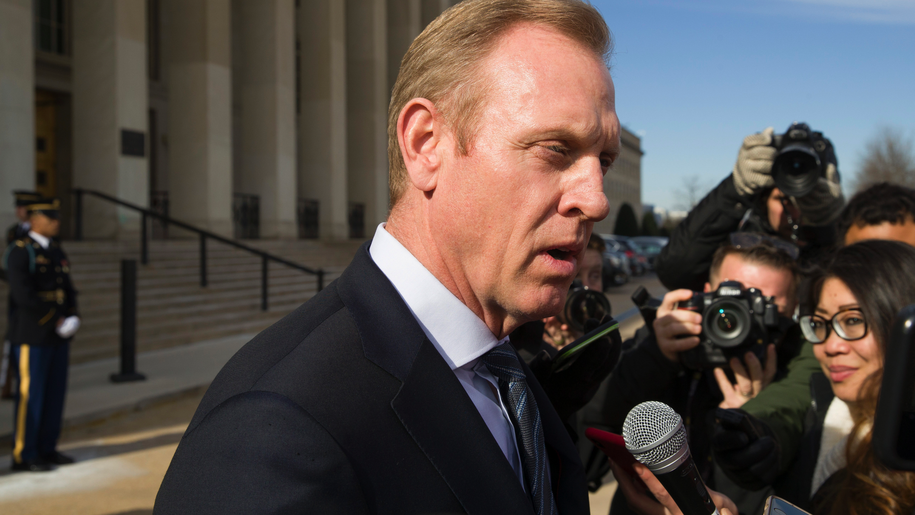 FILE - In this Jan. 28, 2019, file photo, acting Defense Secretary Pat Shanahan speaks with the media as he waits for the arrival of NATO Secretary General Jens Stoltenberg at the Pentagon in Washington. The Pentagon's top official, Shanahan, has arrived in Afghanistan to meet with U.S. commanders and Afghan leaders amid a push for peace with the Taliban. (AP Photo/Alex Brandon, File)