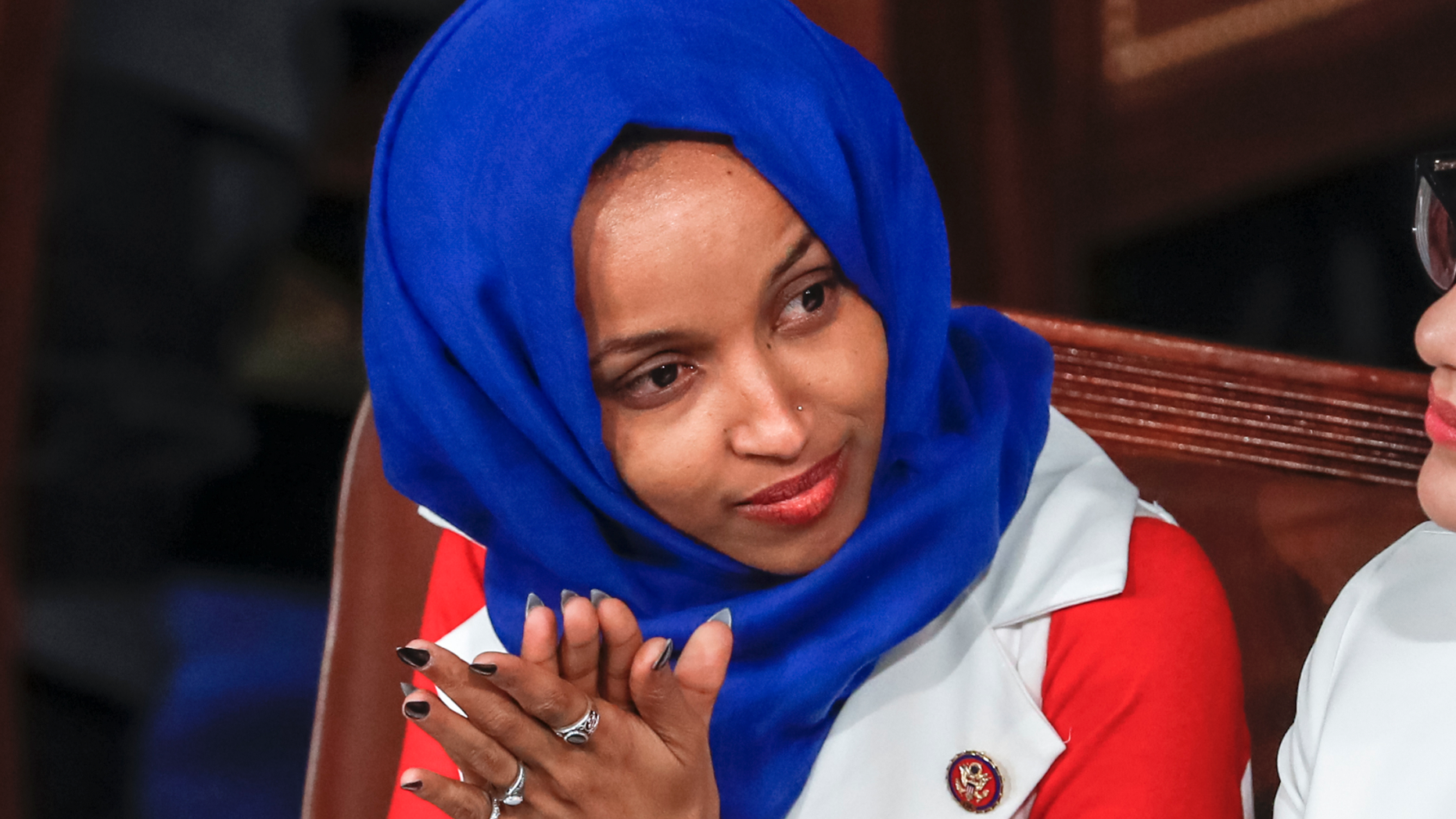 Photo shows Rep. Ilhan Omar, D-Minn., listening to President Donald Trump's State of the Union speech at the Capitol last month. (AP Photo/J. Scott Applewhite)