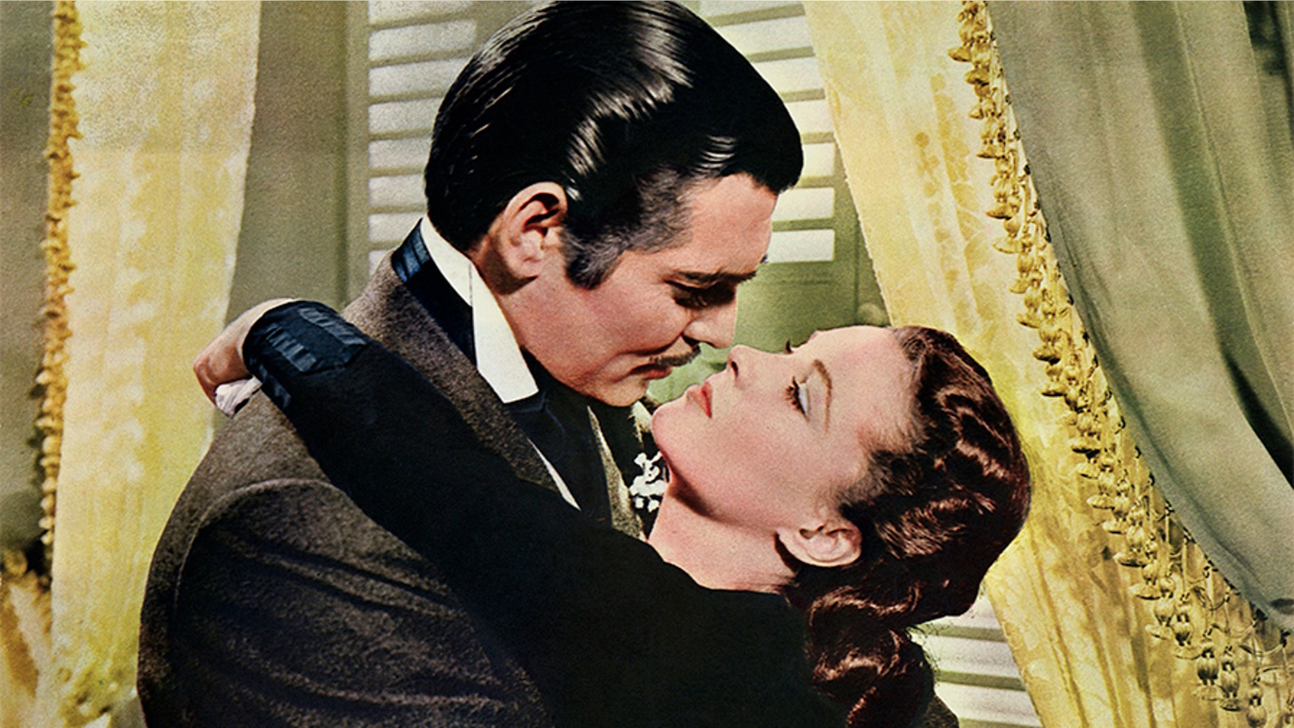 Rhett Butler (Clark Gable) embraces Scarlett O'Hara (Vivien Leigh) in a famous scene from the 1939 epic film "Gone with the Wind." — Getty
