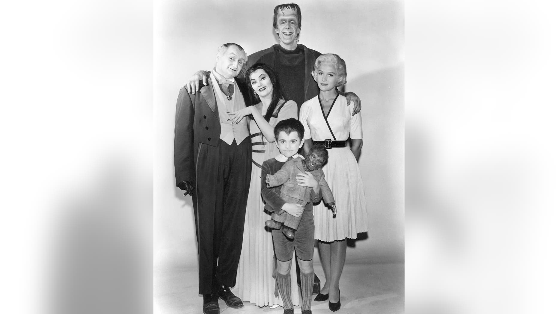 Members of the Munster family in a publicity still for Season 1 of the comedy-horror TV series "The Munsters.," 1964. Left to right: Al Lewis (1923 - 2006) as Grandpa, Yvonne De Carlo as Lily Munster, Butch Patrick as Eddie Munster, Fred Gwynne as Herman Munster and Beverley Owen as Marilyn Munster.