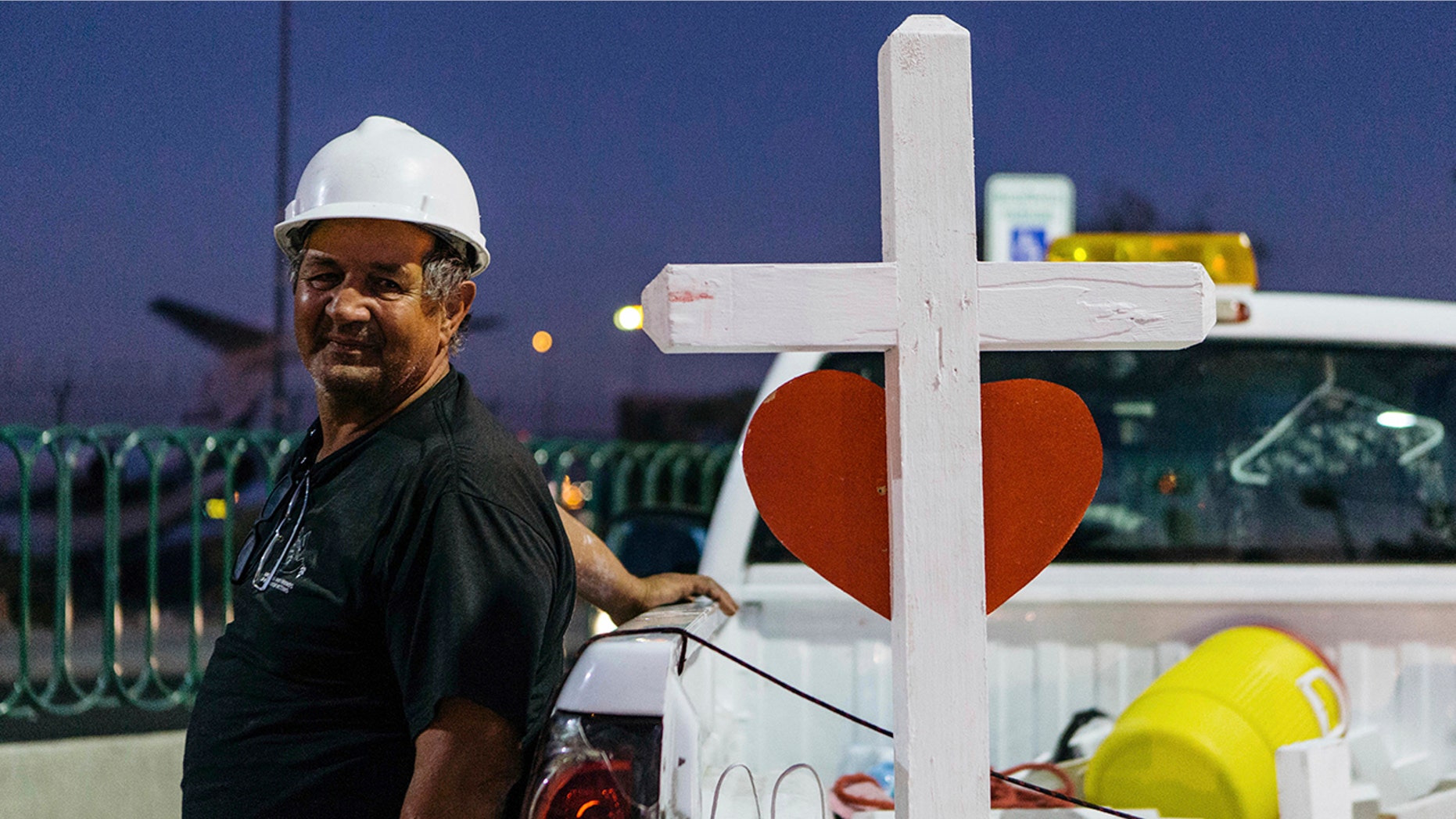 A memorial displaying 58 crosses by Greg Zanis stands at the Welcome To Las Vegas Sign Thursday, Oct. 5, 2017, in Las Vegas. (Mikayla Whitmore/Las Vegas Sun via AP)