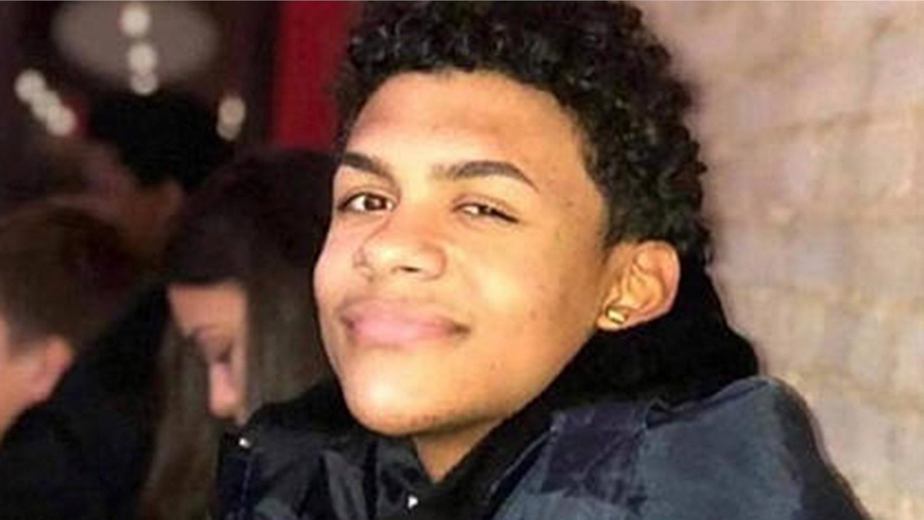 A suspect in the murder of Lesandro "Junior" Guzman-Feliz, pictured here, entered court on Monday holding a true-crime book about the murders of two prosecutors