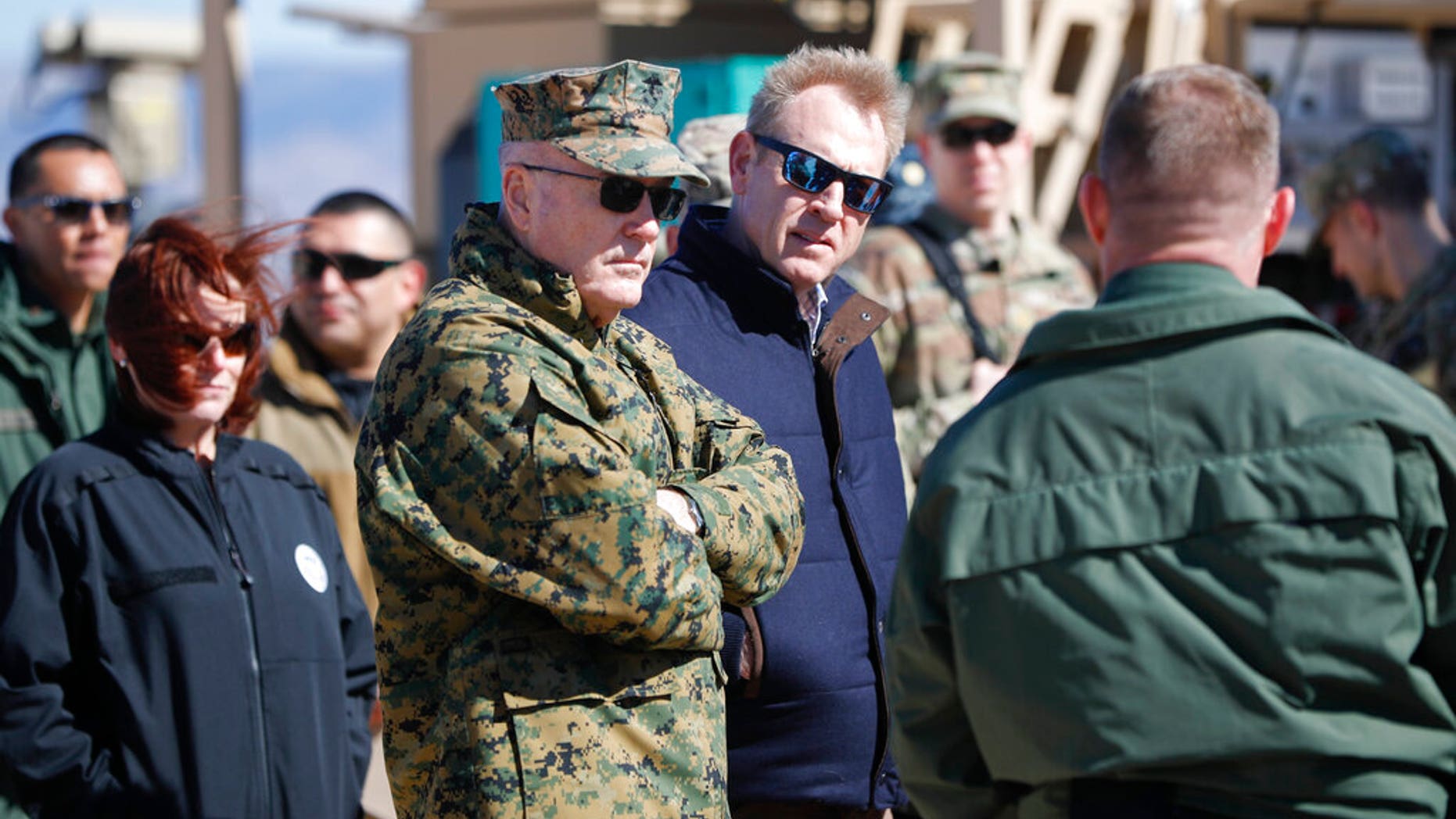 Acting Secretary of Defense Patrick Shanahan, center, and Joint Chiefs Chairman Gen. Joseph Dunford, left, tour the US-Mexico border at Santa Teresa Station in Sunland Park, N.M., Saturday, Feb. 23, 2019. Top defense officials toured sections of the U.S.-Mexico border Saturday to see how the military could reinforce efforts to block drug smuggling and other illegal activity, as the Pentagon weighs diverting billions of dollars for President Donald Trump's border wall. (AP Photo/Pablo Martinez Monsivais)
